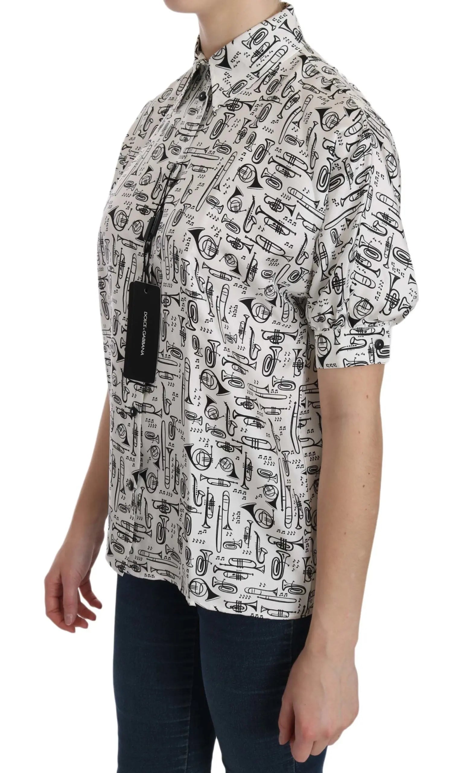 White silk short-sleeve blouse with black musical instrument print and pointed collar.