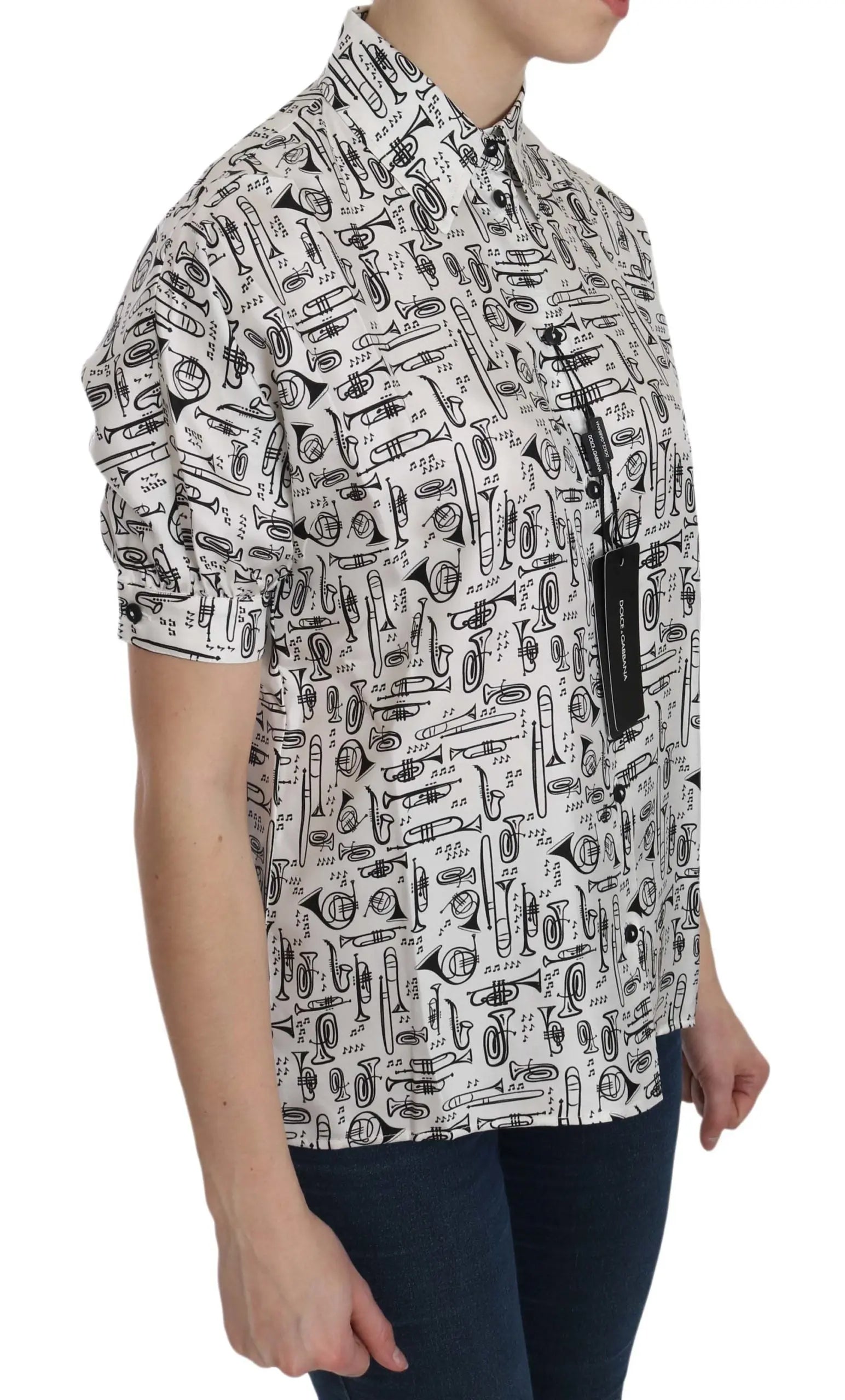 White silk short-sleeve blouse with black musical instrument print and pointed collar.