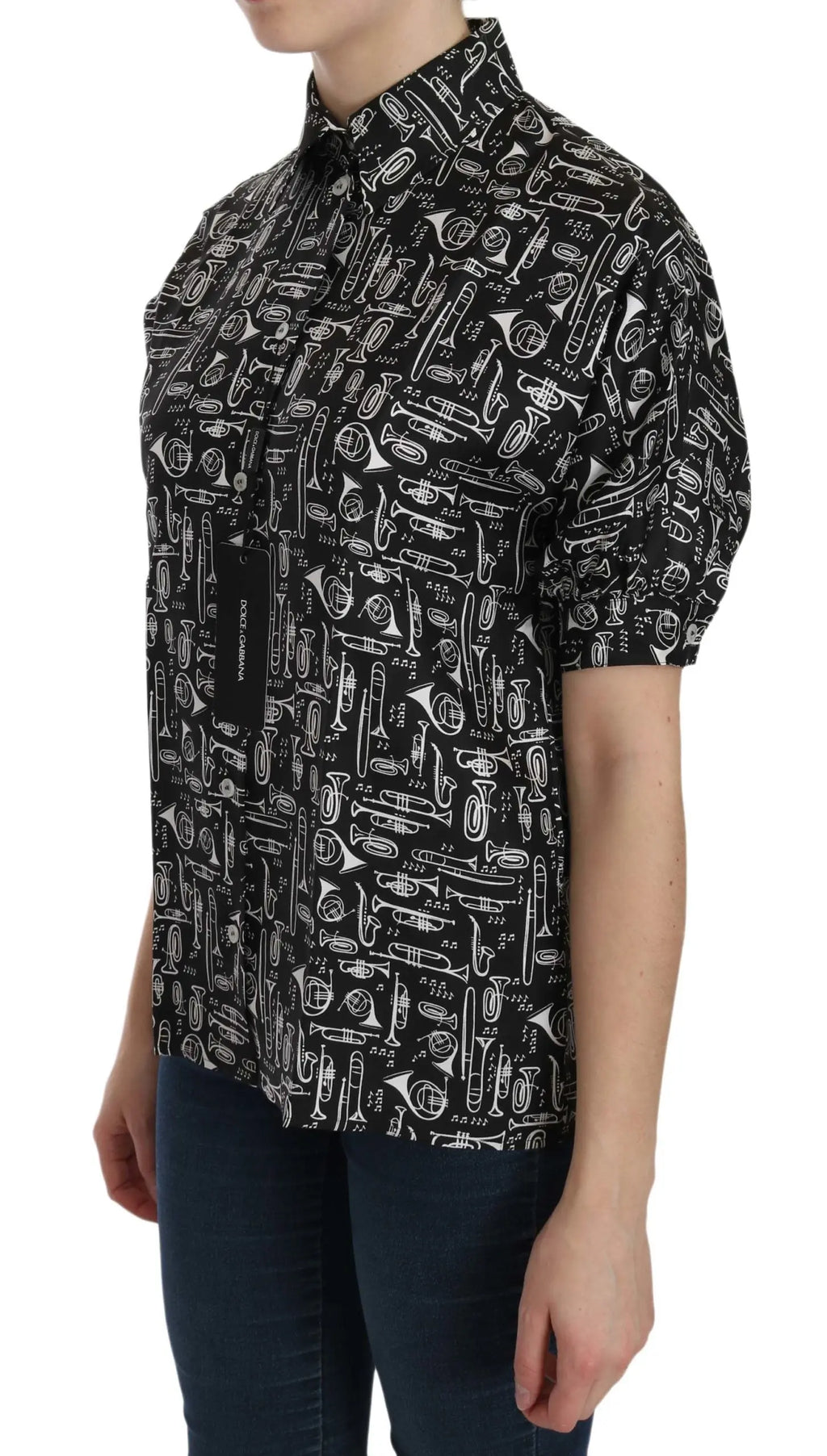 Black silk blouse with white musical instrument print, short sleeves, and collared neck.