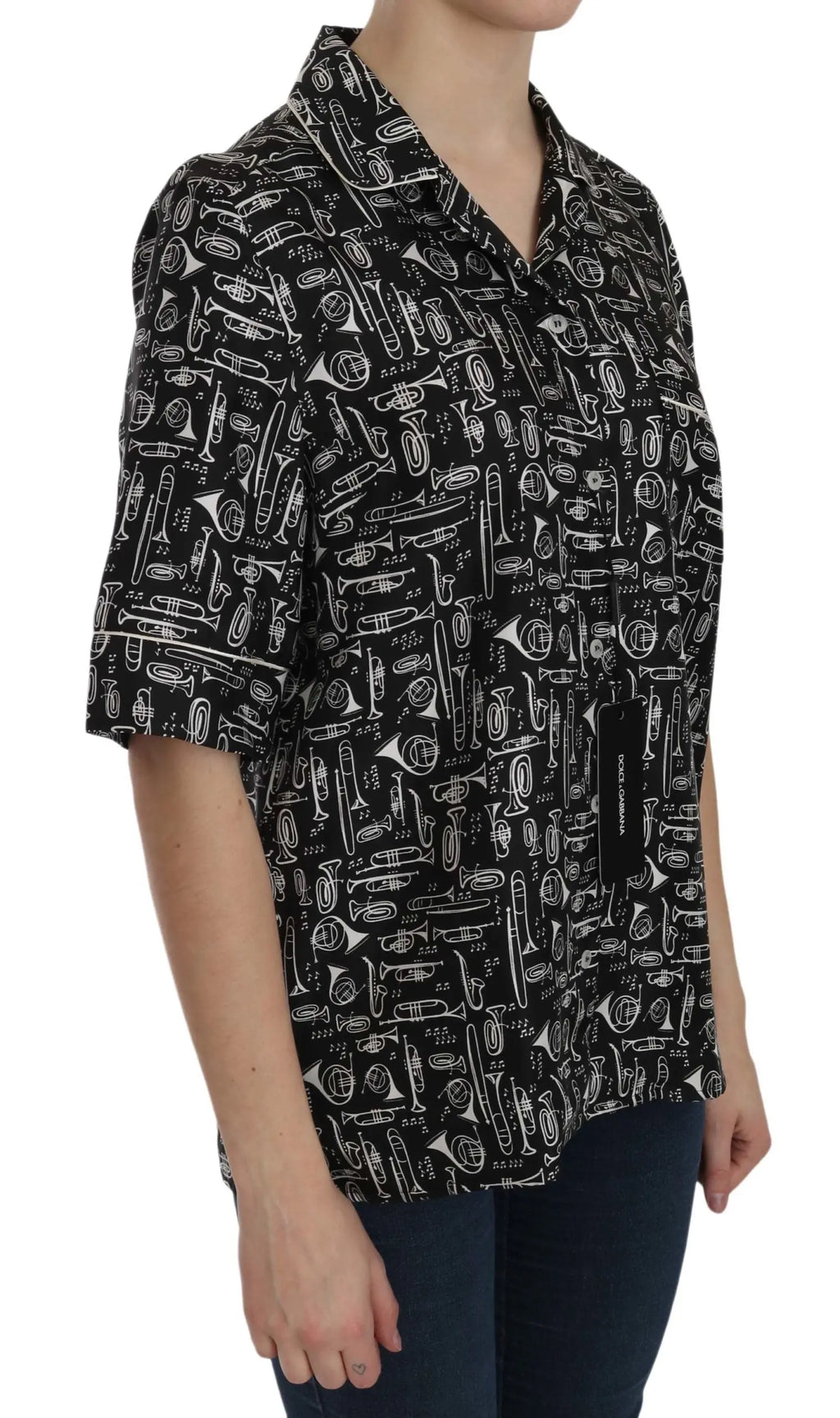 Black short-sleeve silk blouse with white musical instrument print and notched collar.