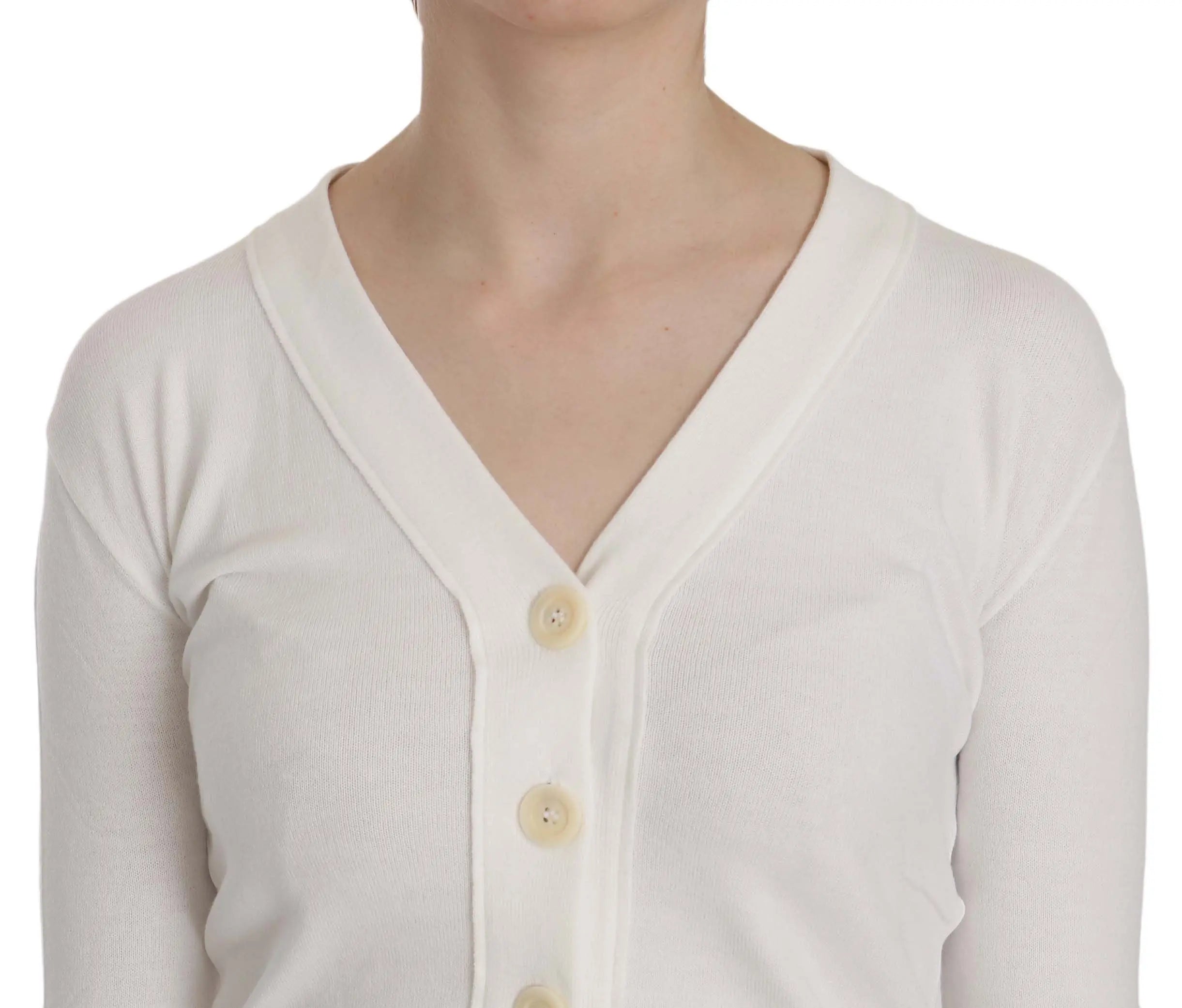 White V-neck cropped cardigan sweater with long sleeves and buttons down front.