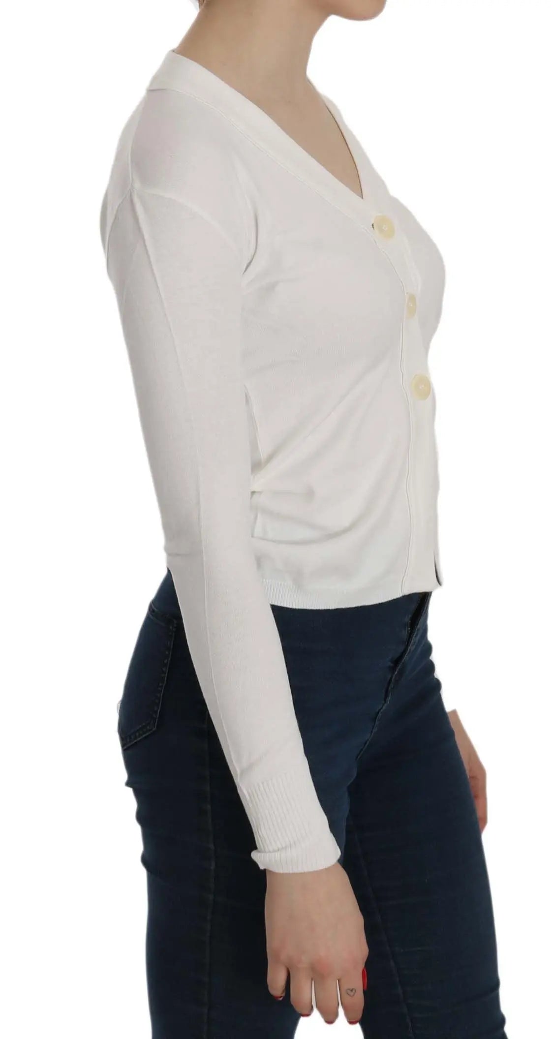 White V-neck cropped cardigan sweater with long sleeves and buttons down front.
