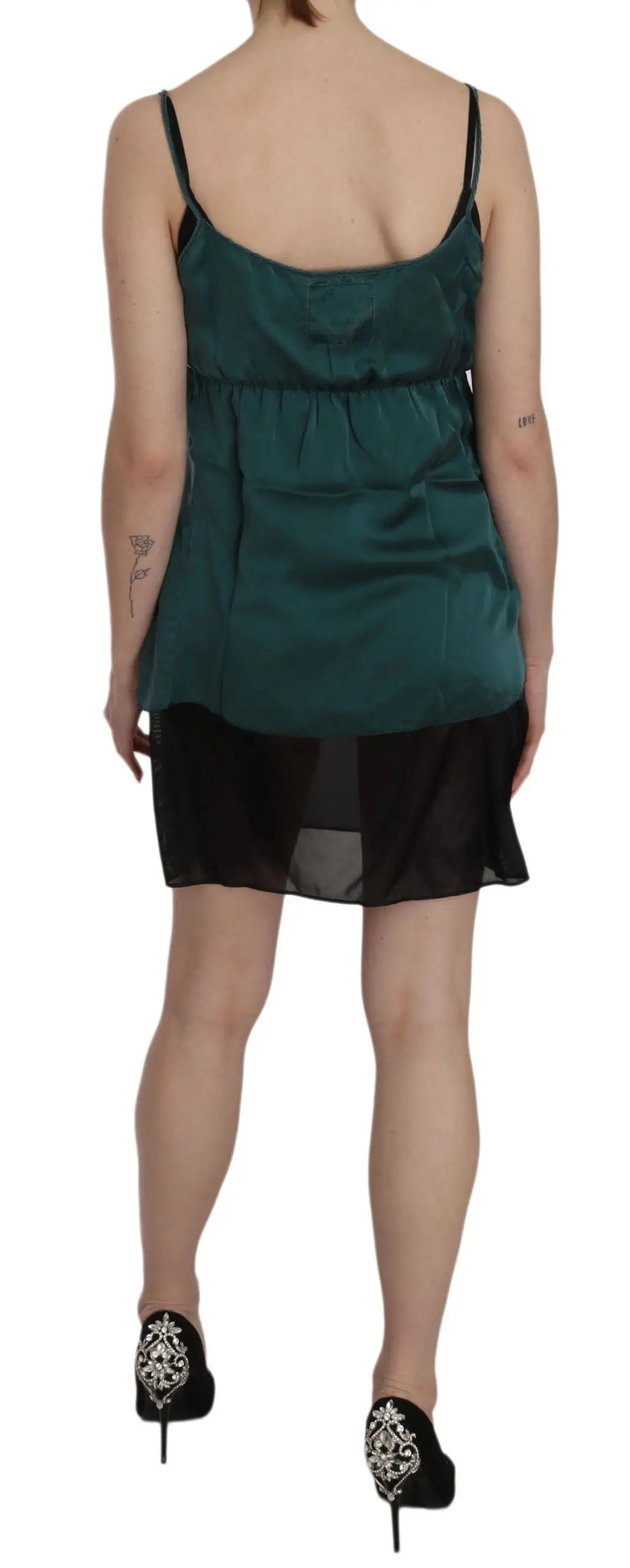 Green silk spaghetti strap shift mini dress with V-neck and sheer black hem.