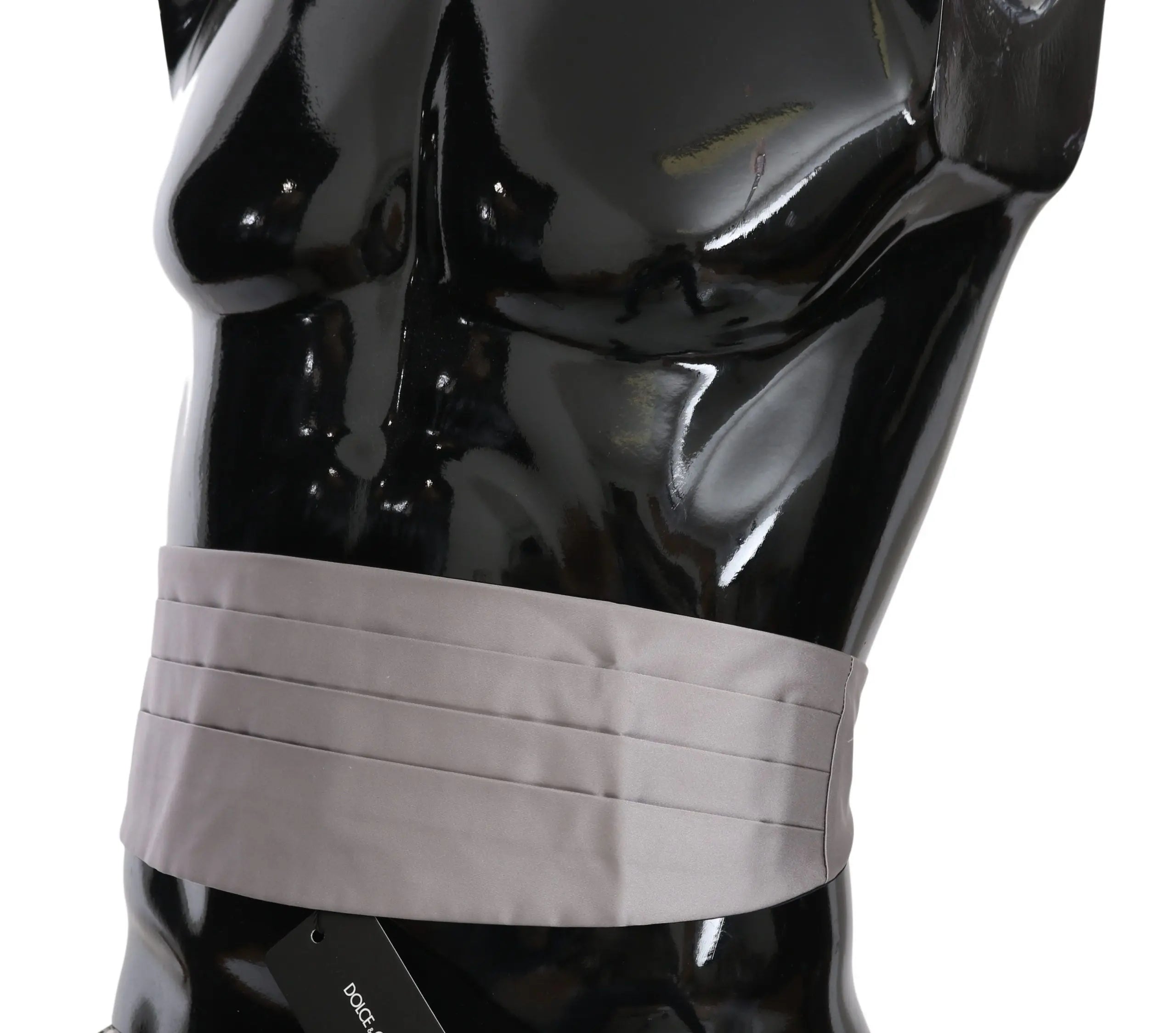 Gray silk pleated men's cummerbund waist belt on black mannequin torso.