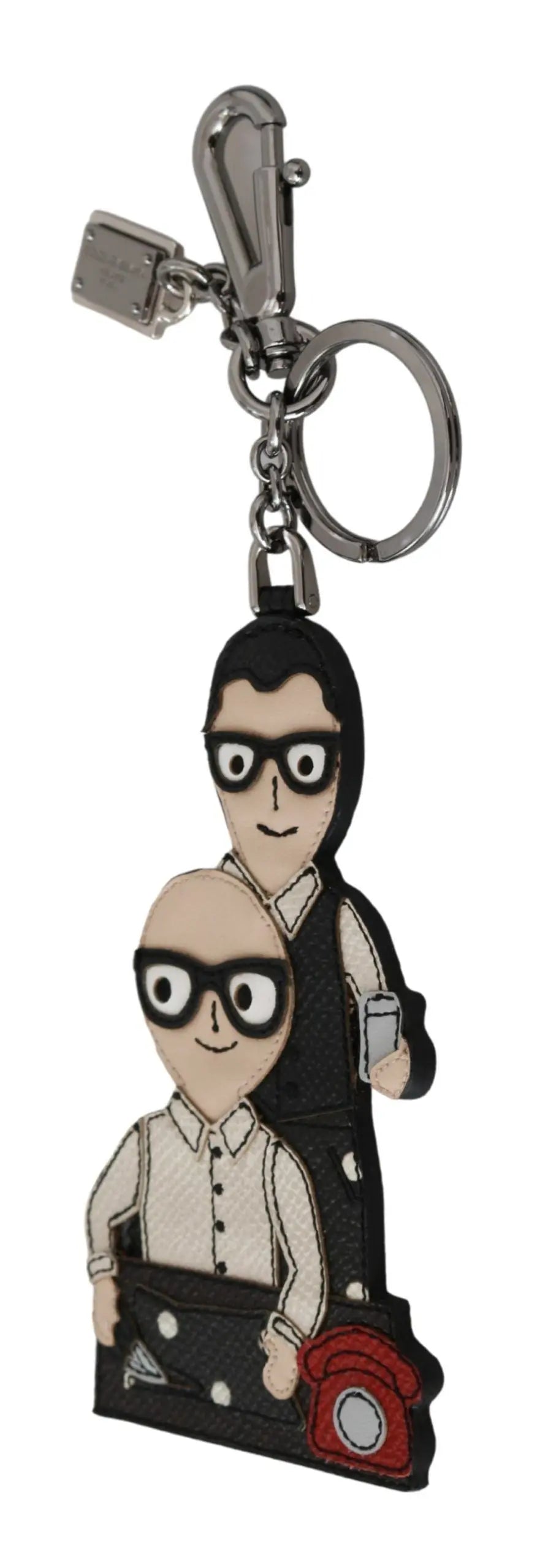 Leather keychain with two cartoon figures wearing glasses and a red camera accessory on a brass chain and clasp.