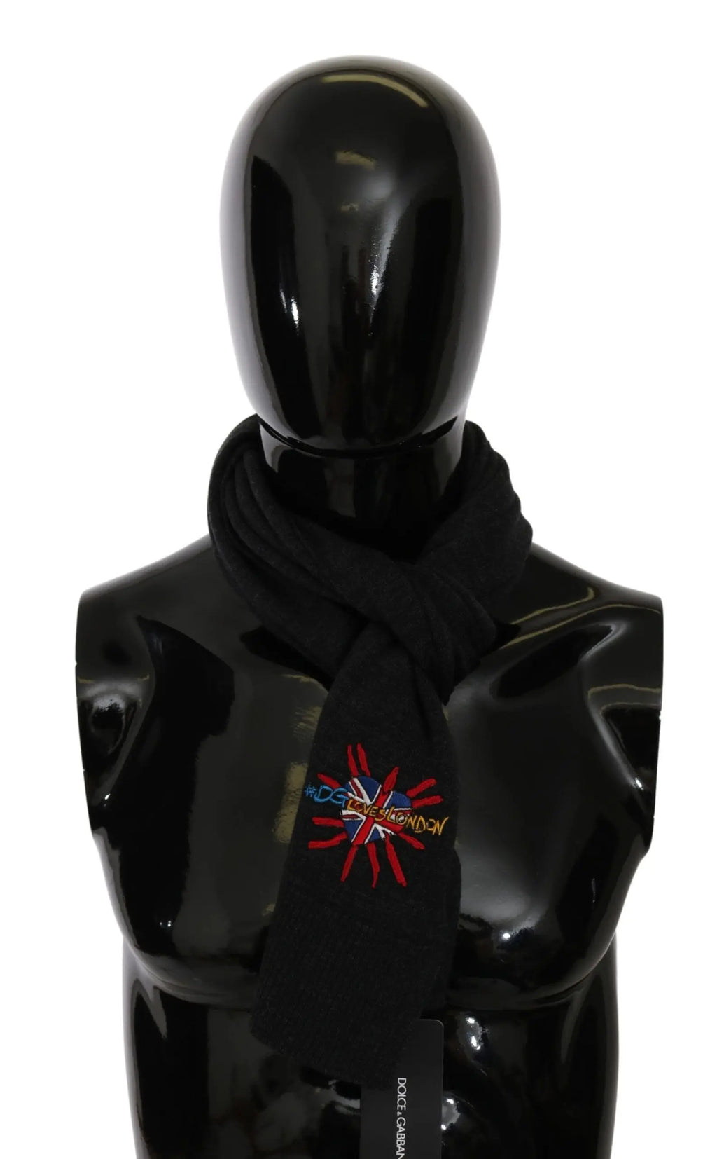 Gray wool scarf with embroidered multicolor starburst detail on black mannequin bust.