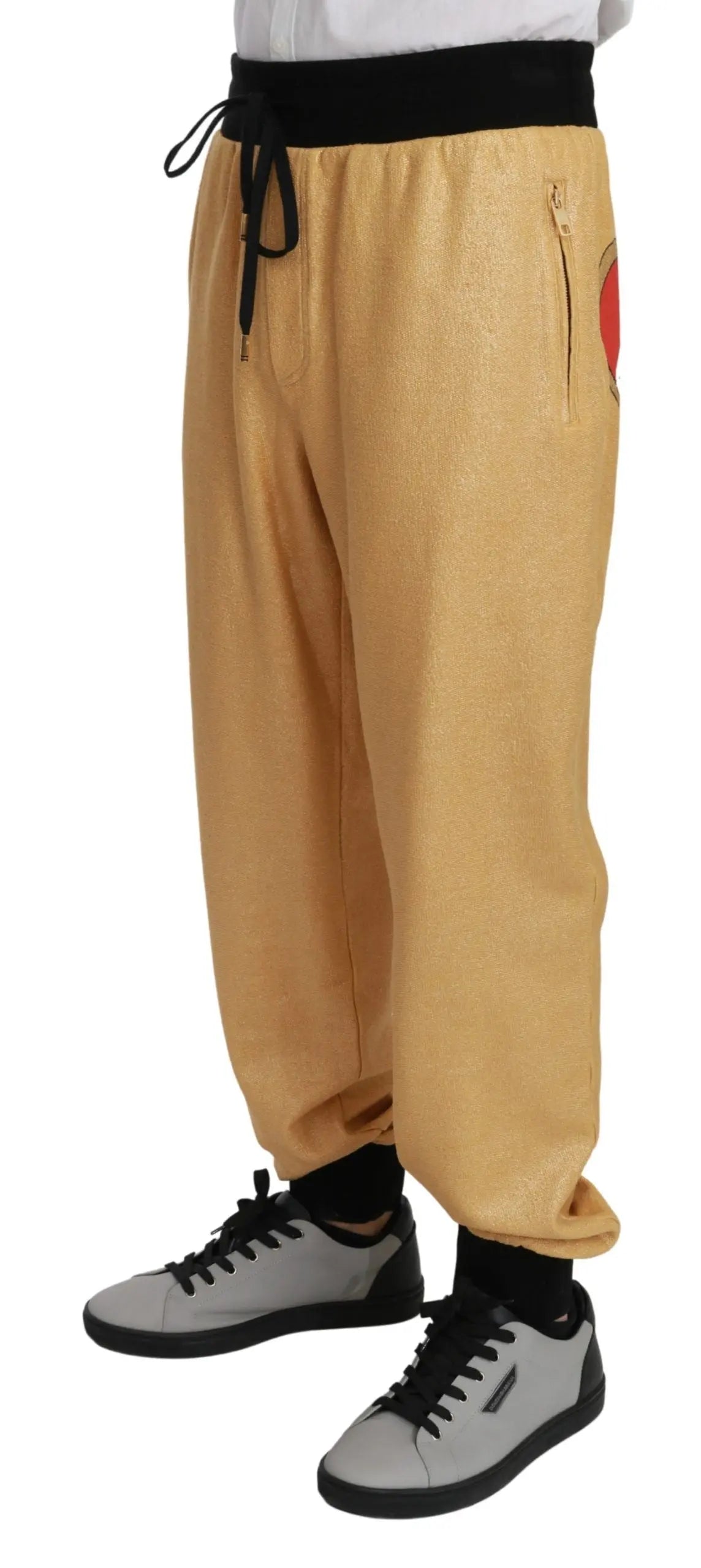 Gold cotton jogger pants with black drawstring waistband, relaxed fit, men's sportswear.