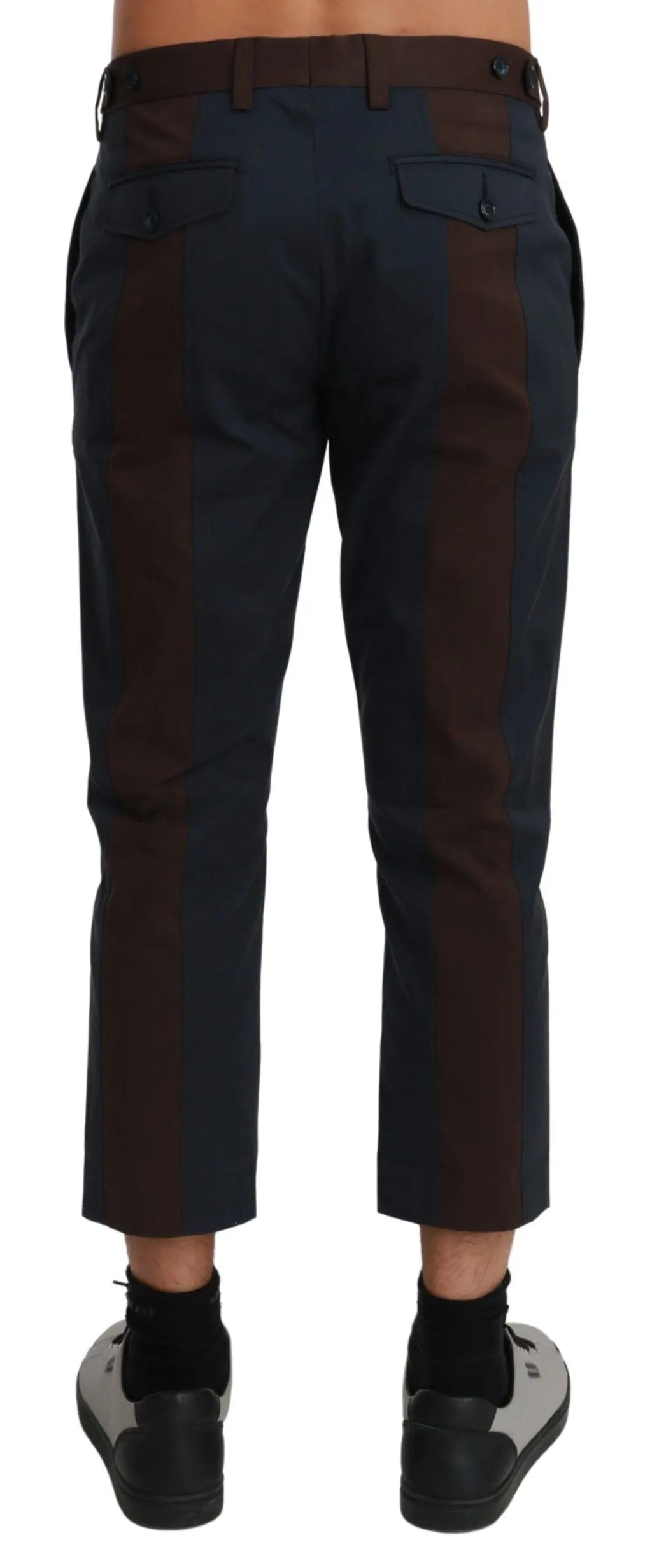 Men's cropped dark brown trousers with subtle vertical stripes, tailored fit.