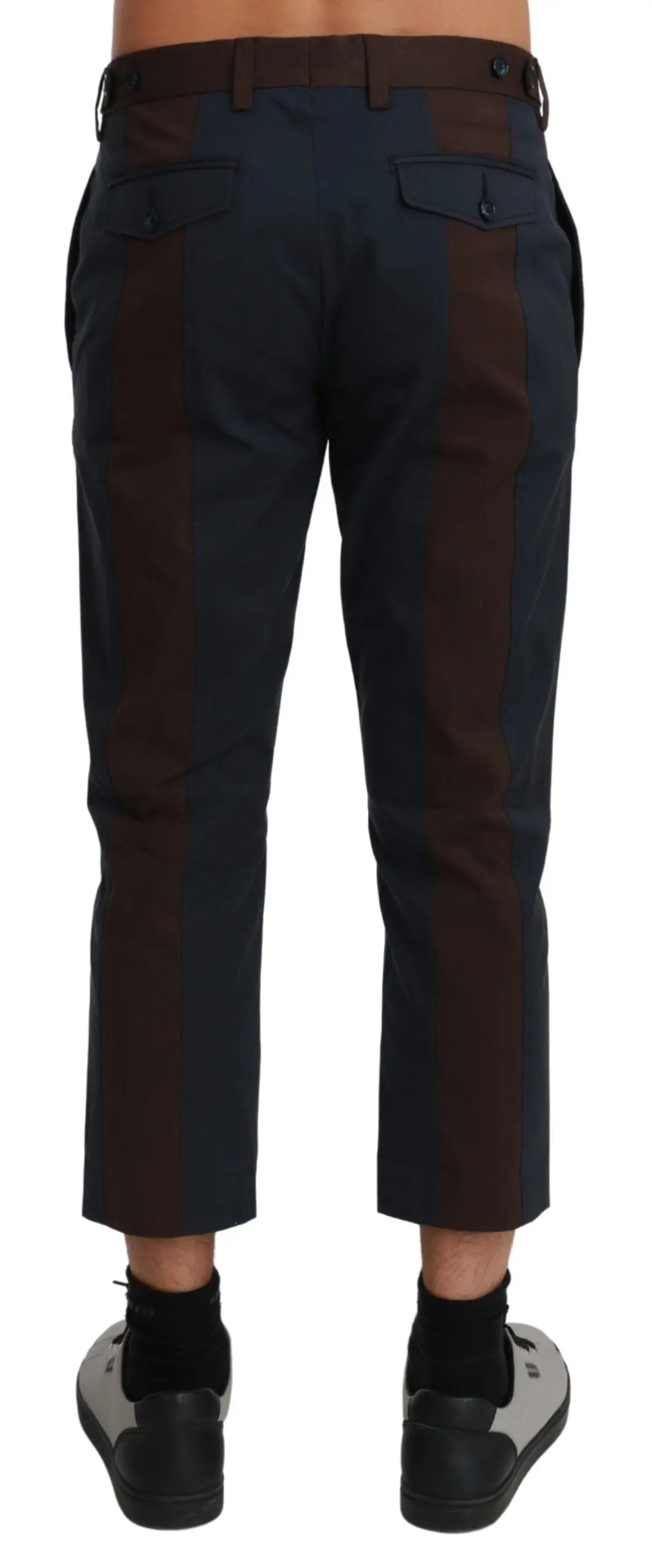 Men's cropped dark brown trousers with subtle vertical stripes, tailored fit.