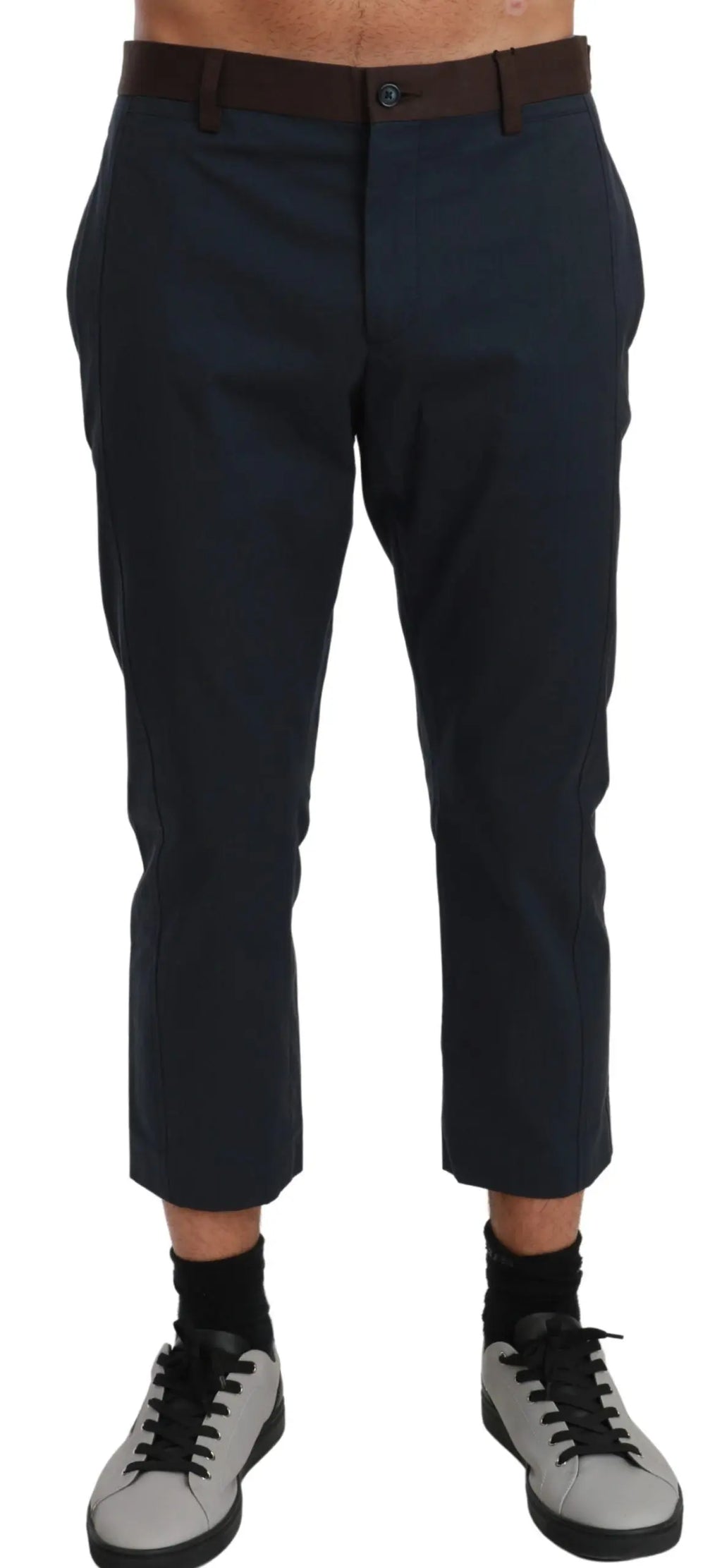 Men's cropped dark brown trousers with subtle vertical stripes, tailored fit.