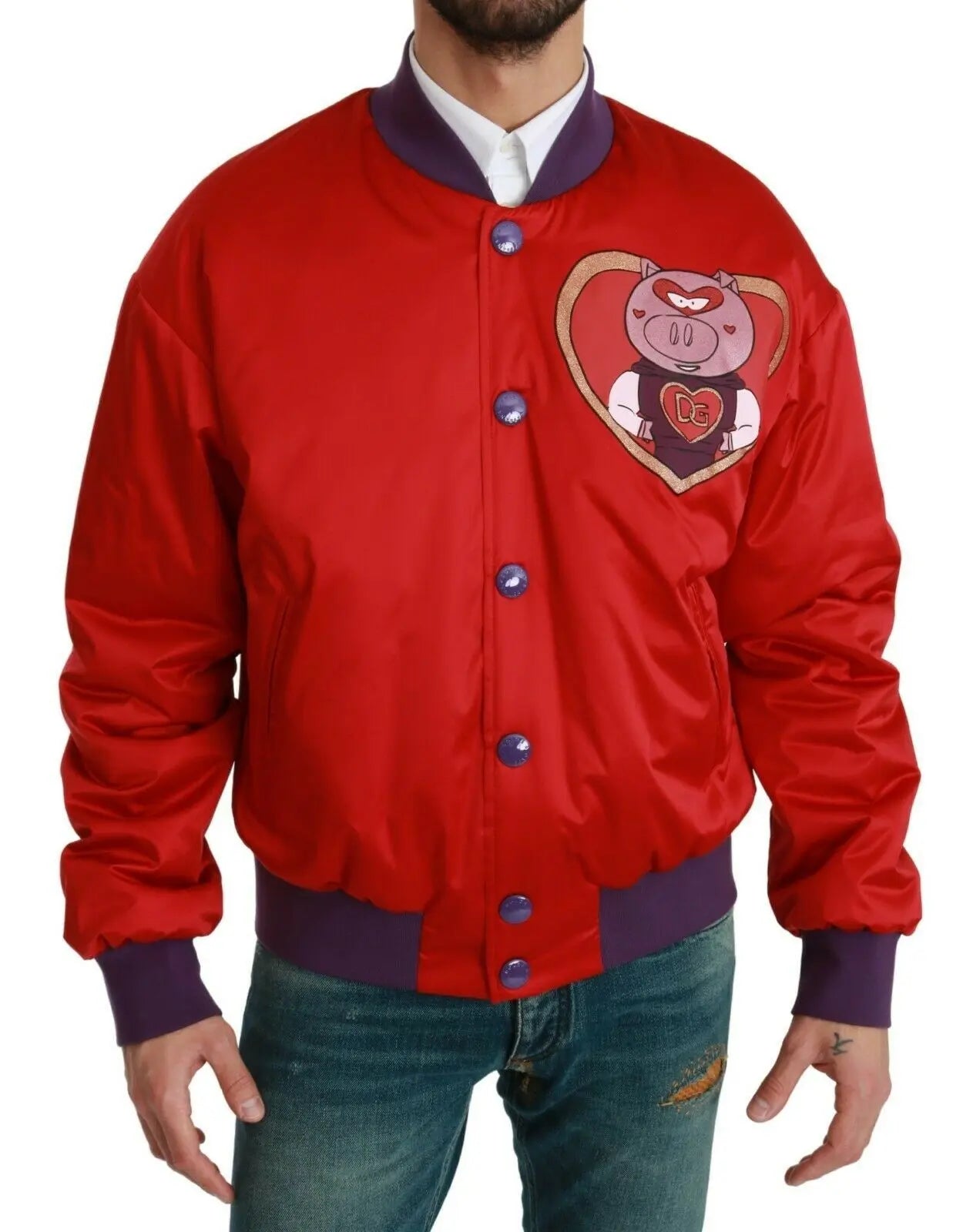 Red bomber jacket with purple ribbed cuffs and hem, featuring a pig emblem patch on the chest and blue snap buttons.