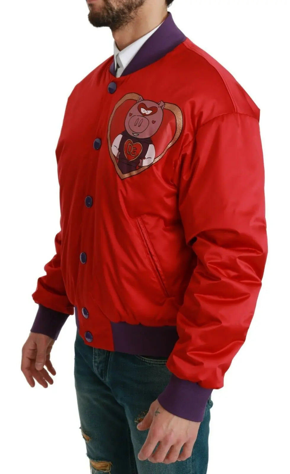 Red bomber jacket with purple ribbed cuffs and hem, featuring a pig emblem patch on the chest and blue snap buttons.