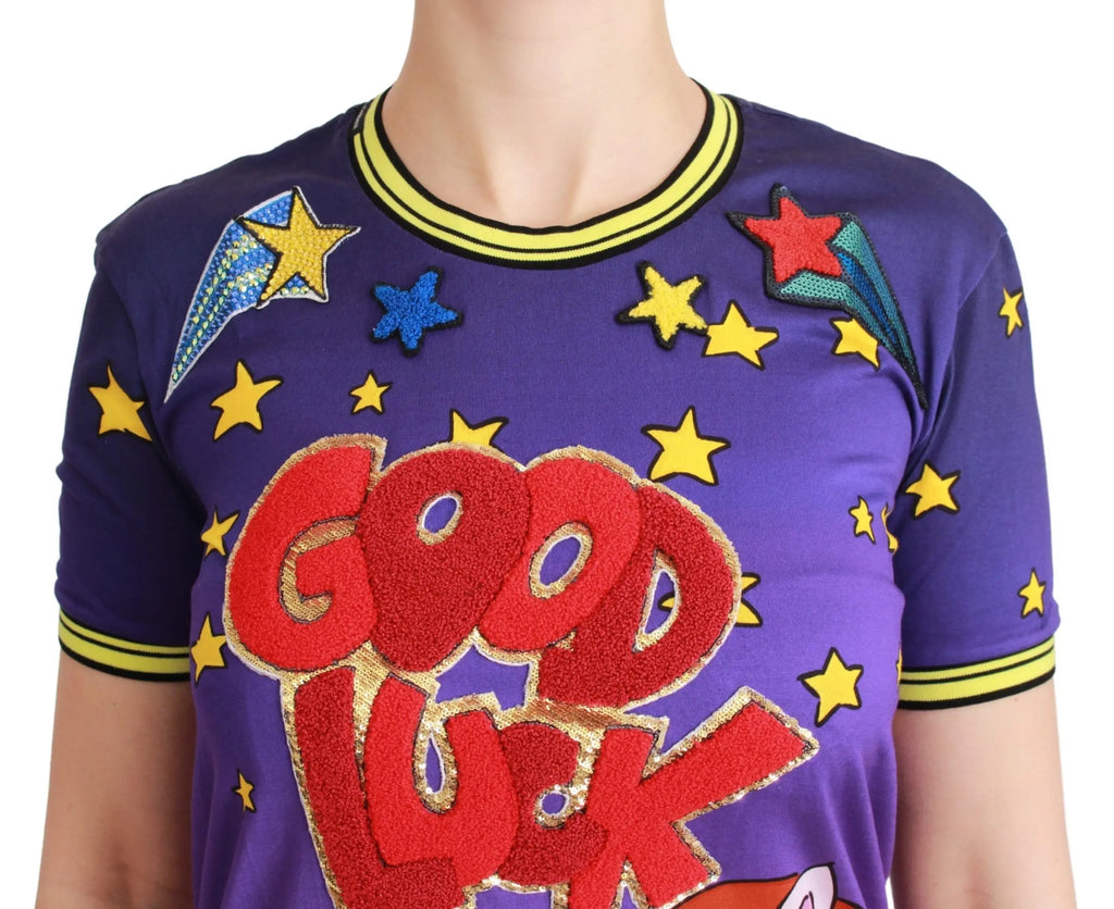 Purple cotton T-shirt with yellow stars and "Good Luck" text featuring two cartoon pigs on front.