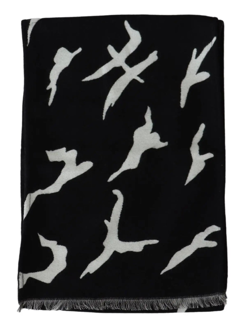 Black and white wool scarf with abstract pattern, fringed ends, styled around mannequin neck.