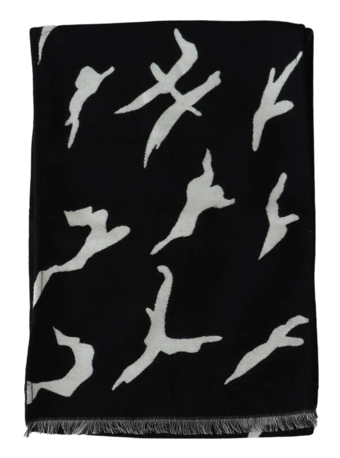 Black and white wool scarf with abstract pattern, fringed ends, styled around mannequin neck.