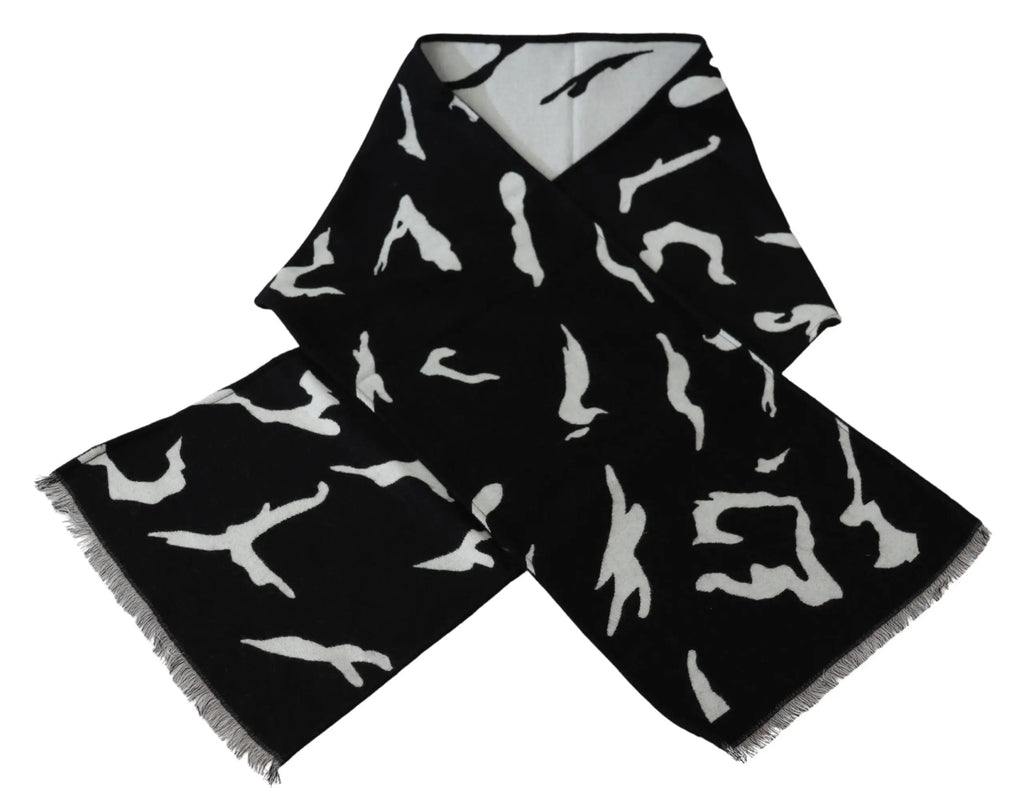 Black and white wool scarf with abstract pattern, fringed ends, styled around mannequin neck.