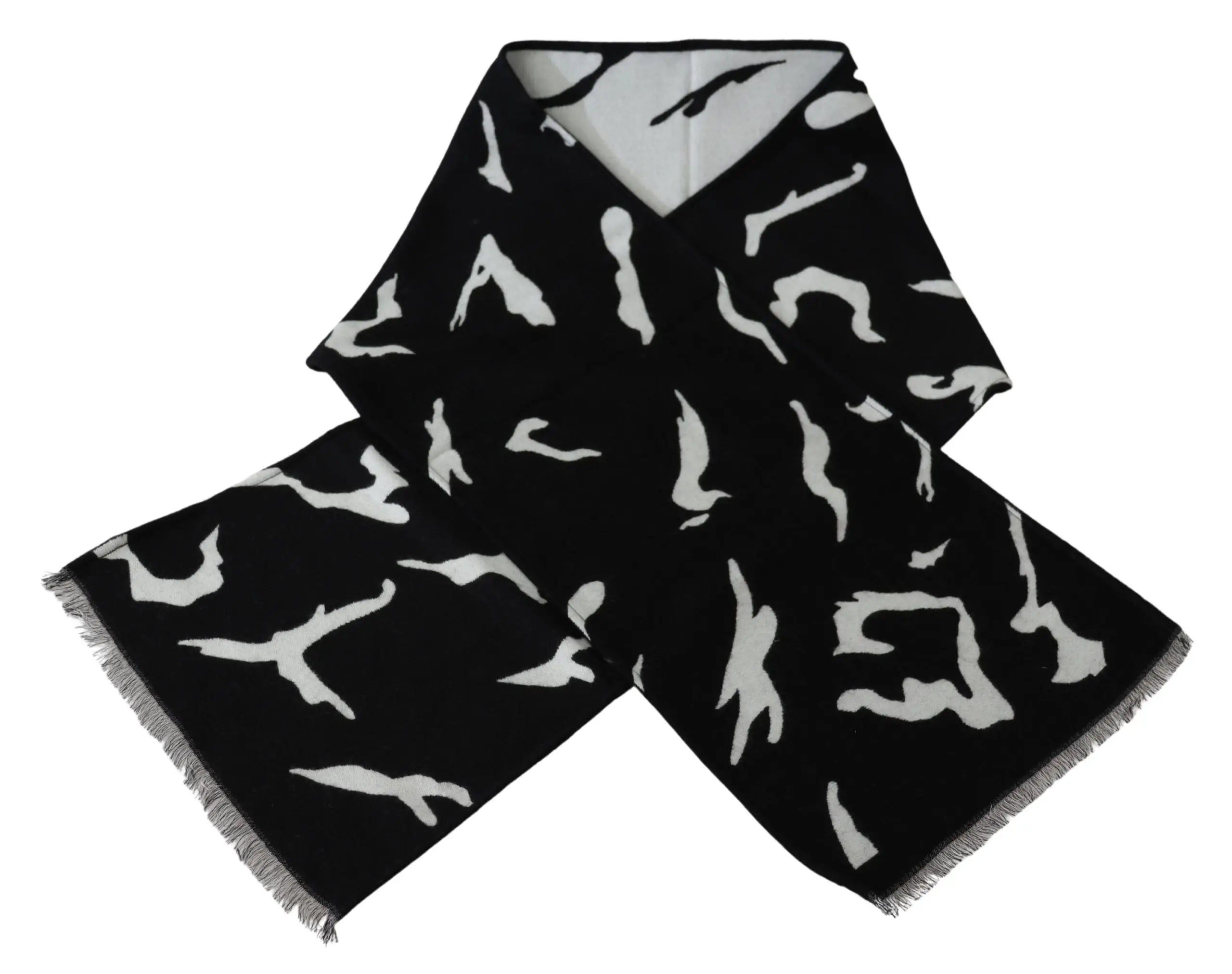Black and white wool scarf with abstract pattern, fringed ends, styled around mannequin neck.