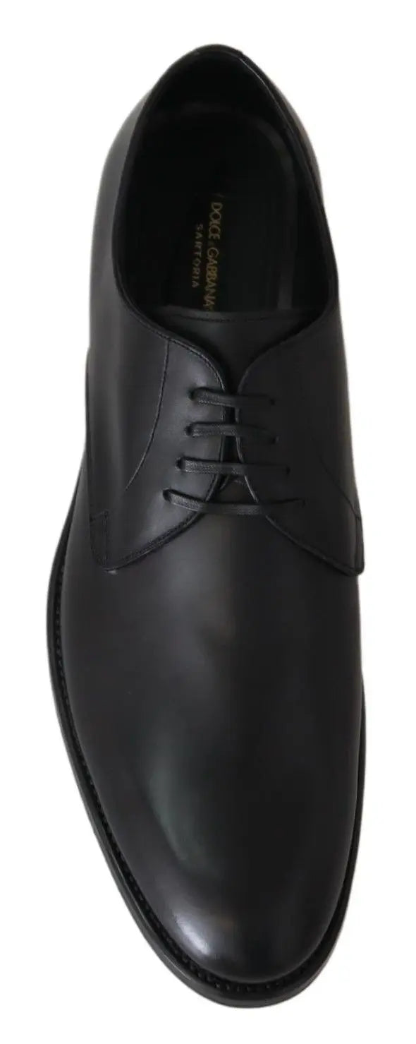 Black leather men's oxford shoe with sleek rounded toe and thin black sole.