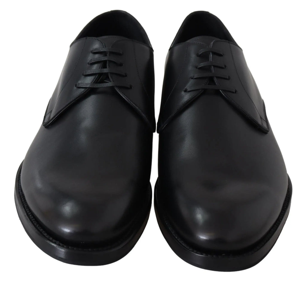 Black leather men's oxford shoe with sleek rounded toe and thin black sole.