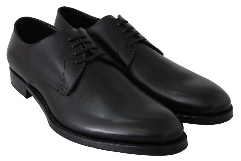 Black leather men's oxford shoe with sleek rounded toe and thin black sole.