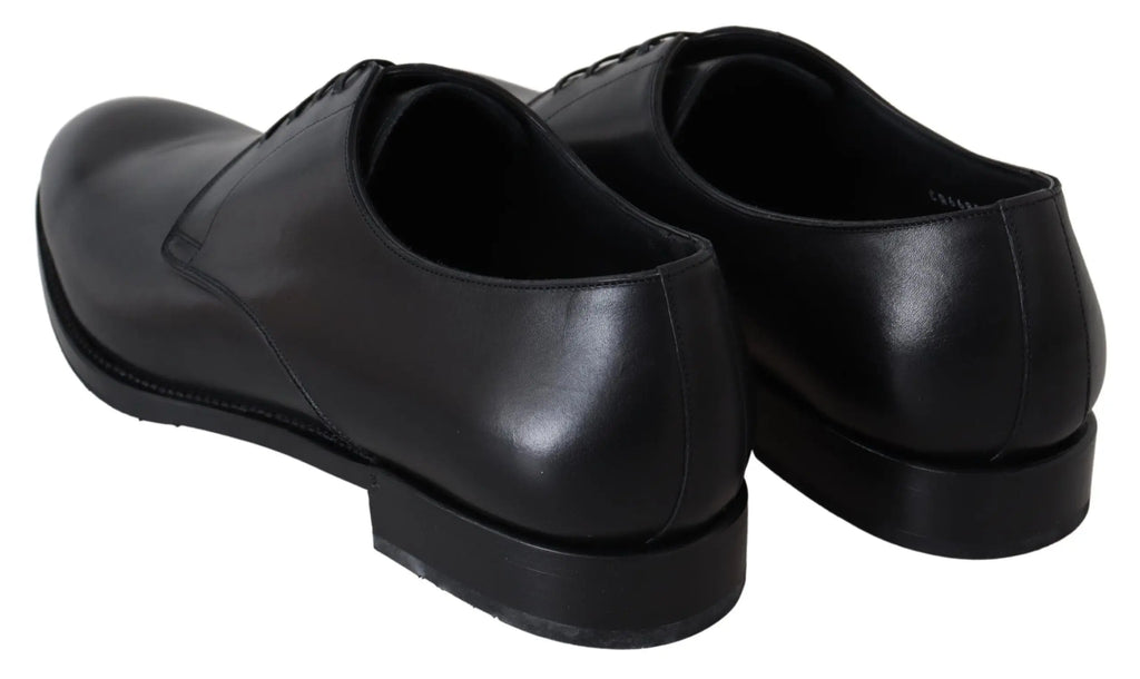 Black leather men's oxford shoe with sleek rounded toe and thin black sole.