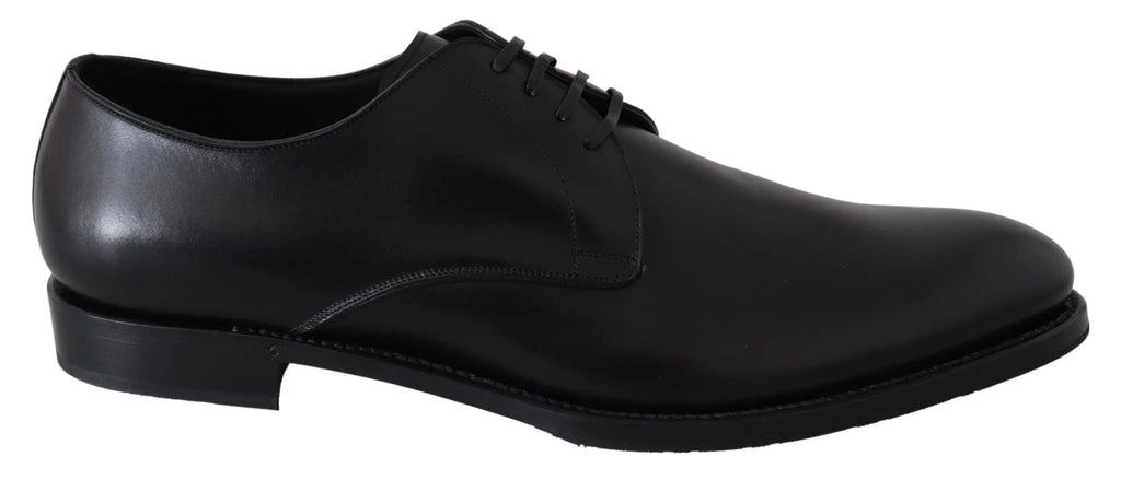 Black leather men's oxford shoe with sleek rounded toe and thin black sole.