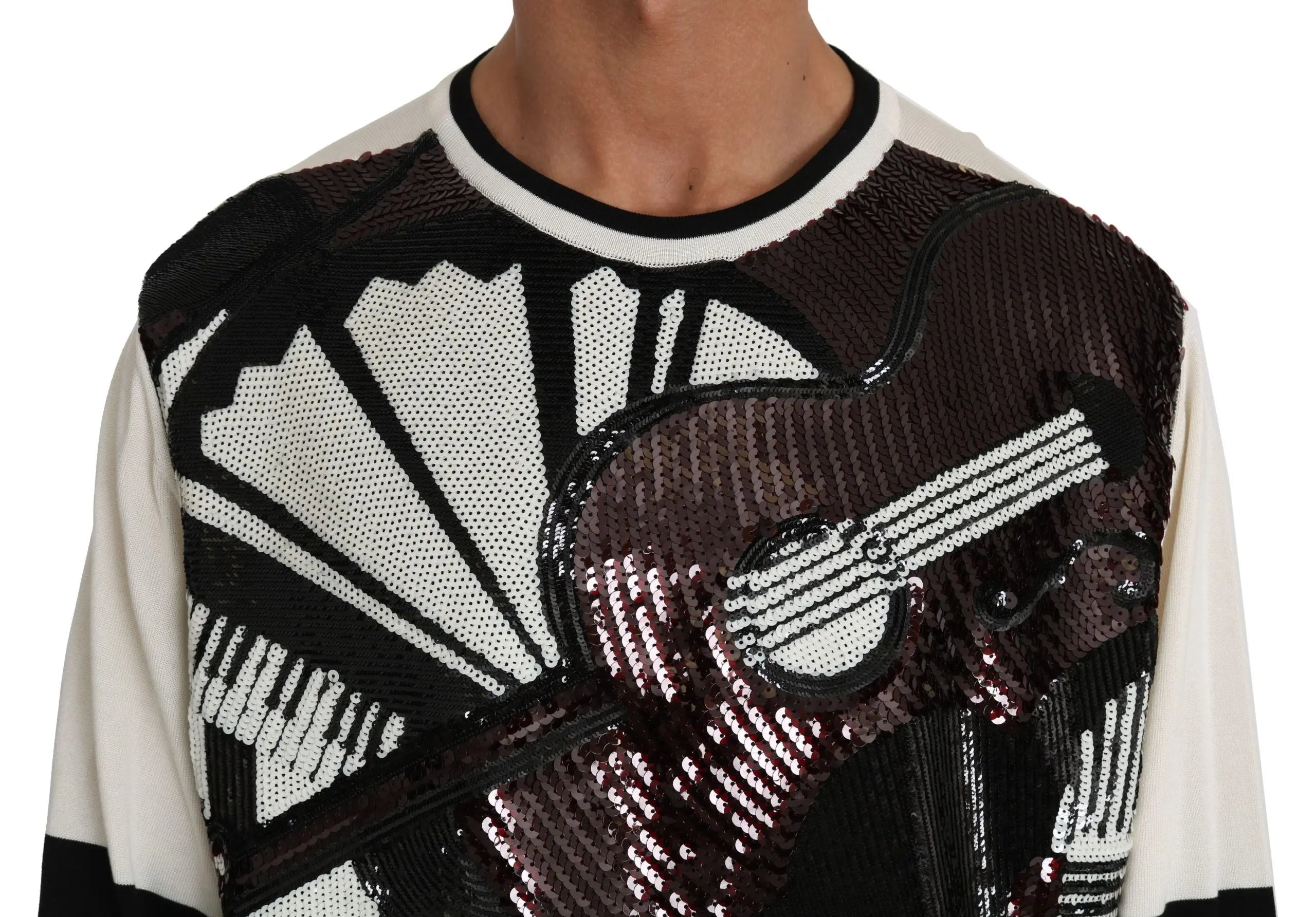 White long-sleeve pullover sweater with black and dark sequined jazz guitar and music note design, black stripes on sleeves.
