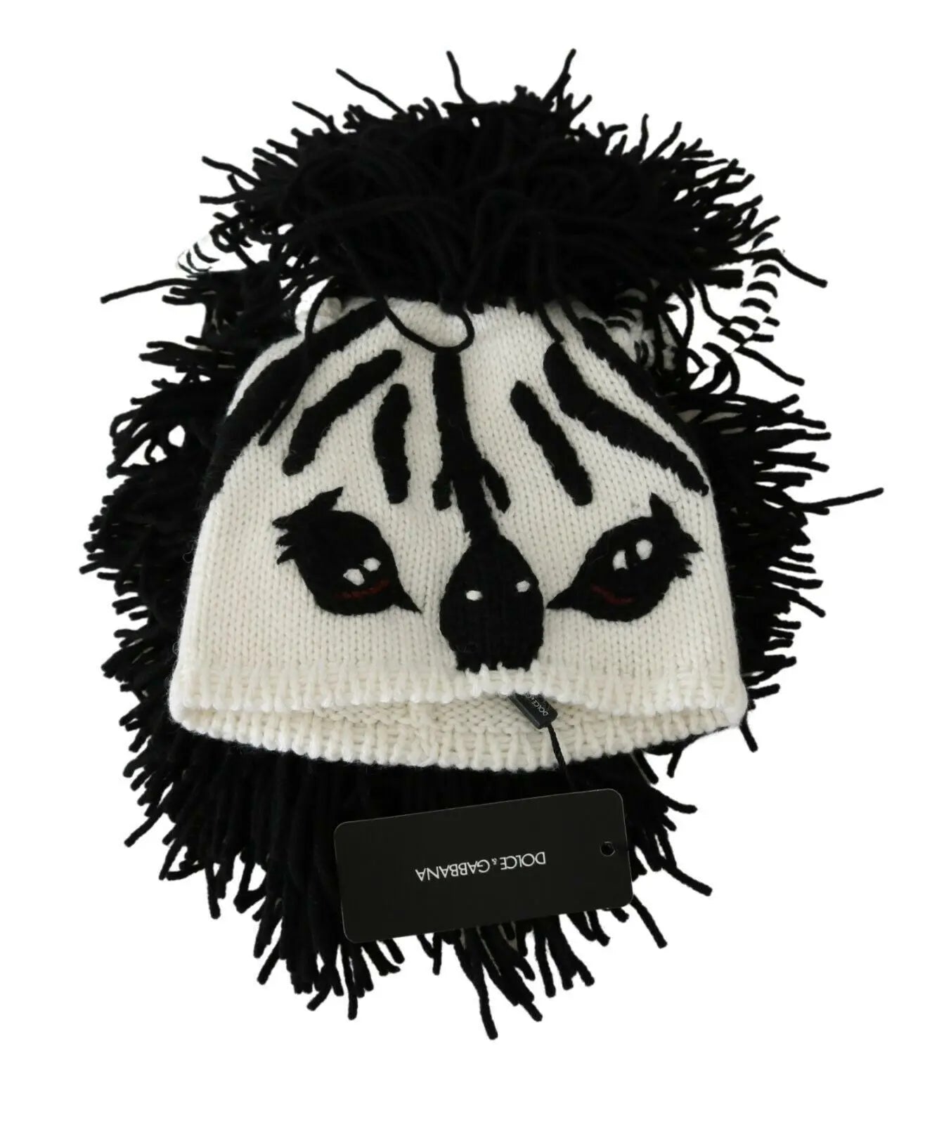 Black and white knitted cashmere beanie with animal face design and black fringe detailing.