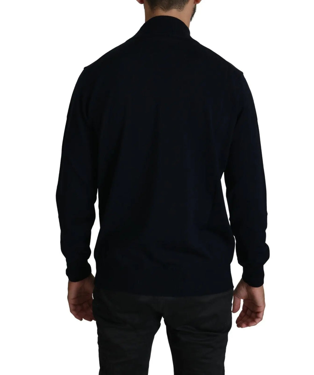 Dark blue crewneck wool pullover sweater with long sleeves and ribbed cuffs and hem.