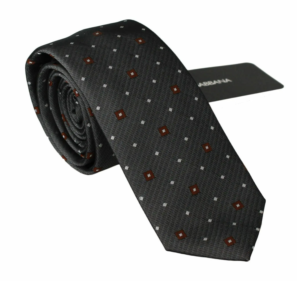 Gray slim necktie with subtle diagonal stripes and small red diamond and white dot pattern.