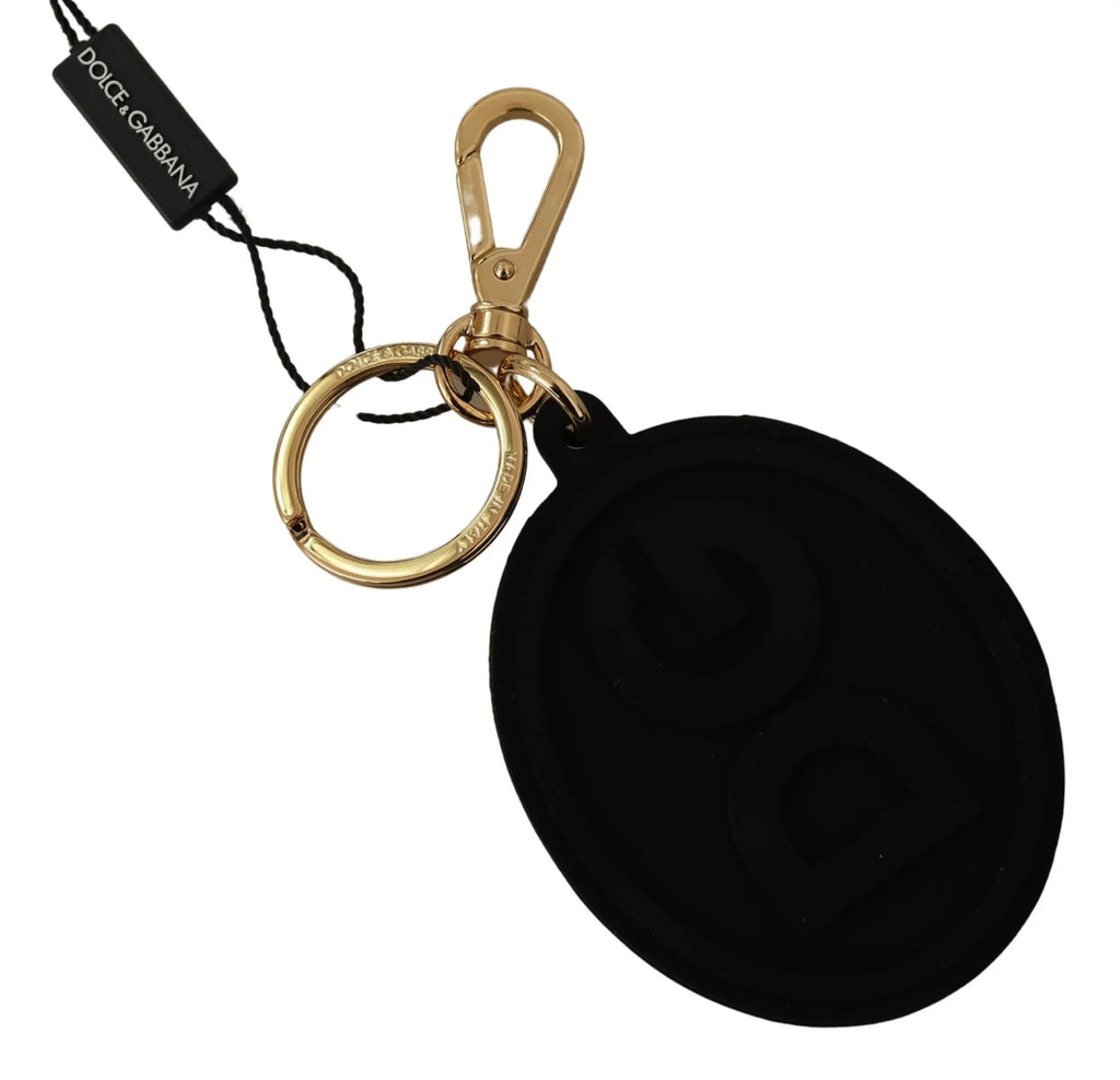 Black rubber oval keyring with embossed DG logo and gold brass metal clip and ring, Dolce & Gabbana tag attached.