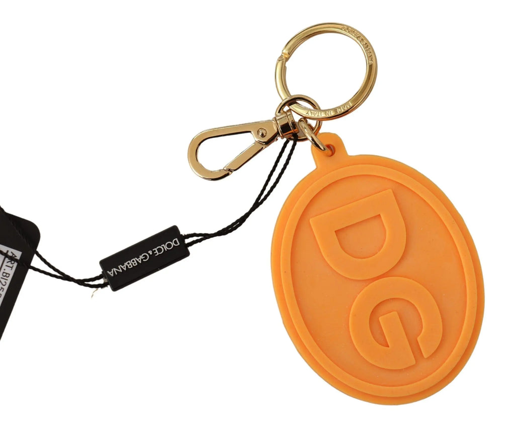 Orange rubber oval keychain with raised DG logo and gold brass ring and clip.