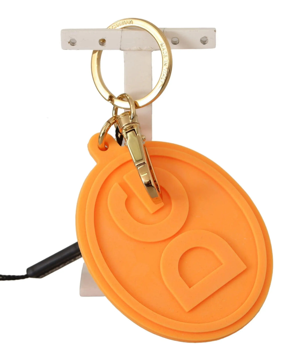 Orange rubber oval keychain with raised DG logo and gold brass ring and clip.