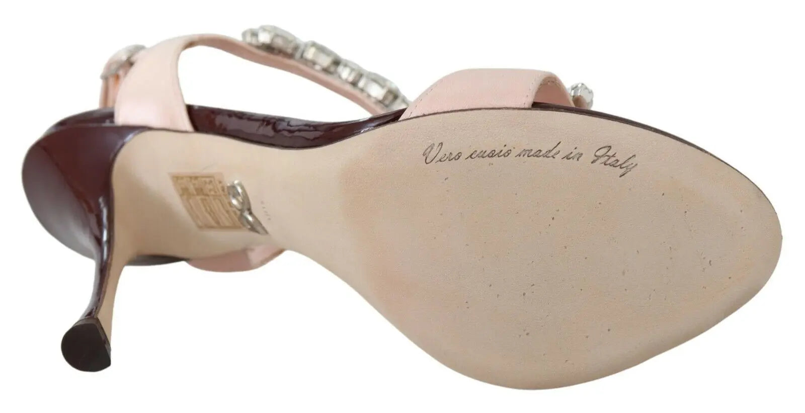 Pink stiletto heel sandal with large crystal embellishments and an ankle strap.