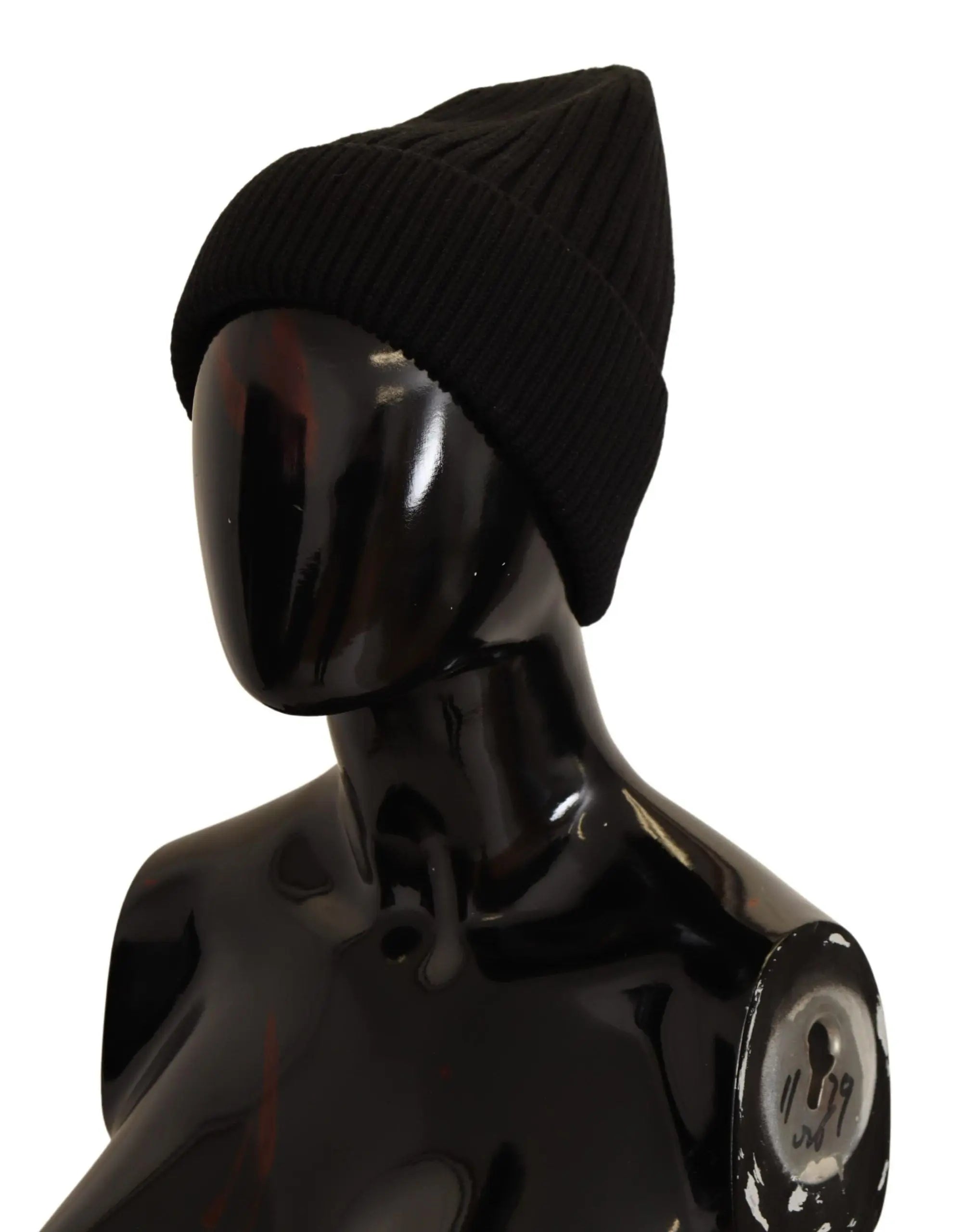 Black ribbed wool knit beanie for women with a folded cuff, shown on a glossy black mannequin head and shoulders.