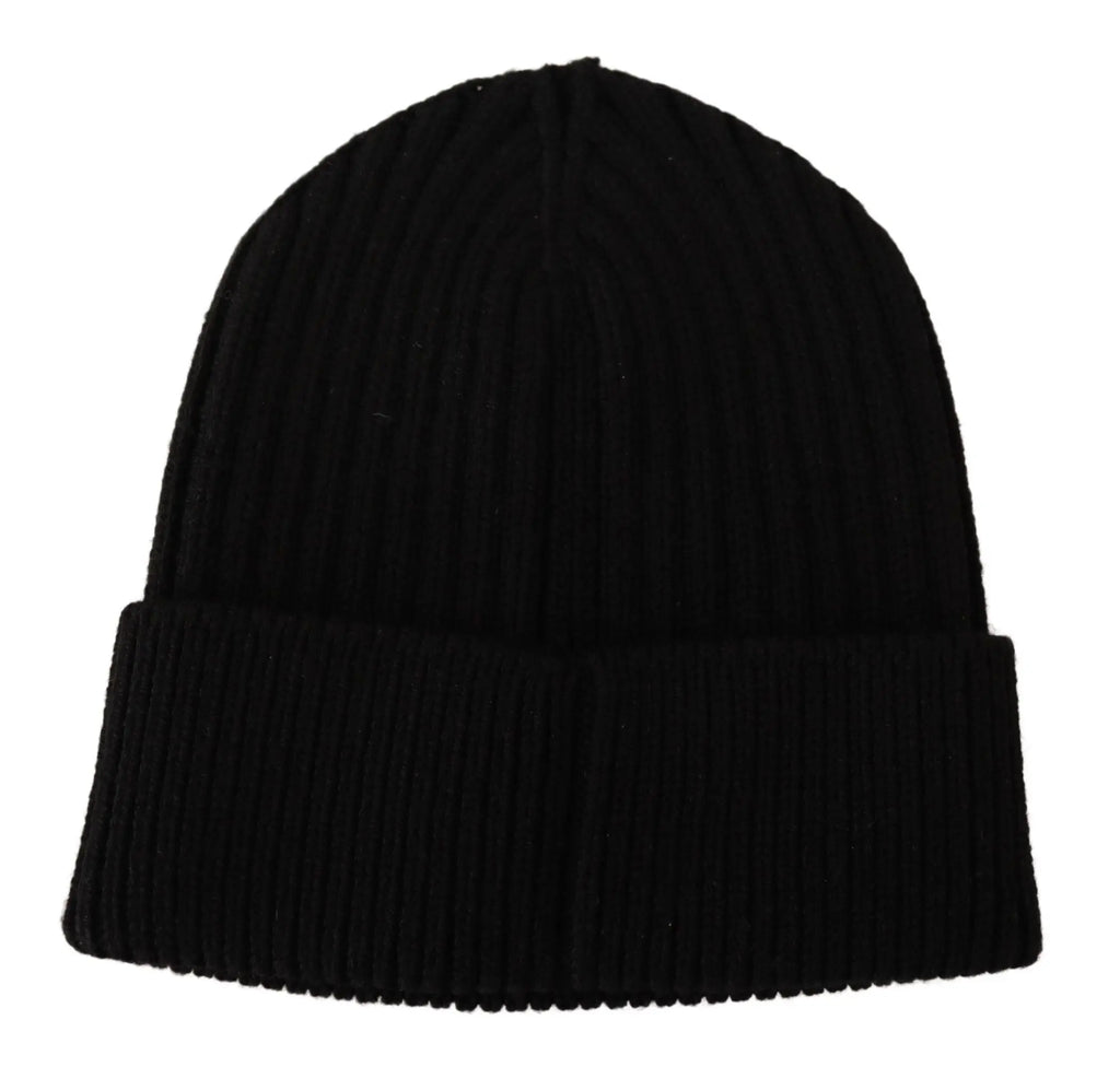 Black ribbed wool knit beanie for women with a folded cuff, shown on a glossy black mannequin head and shoulders.