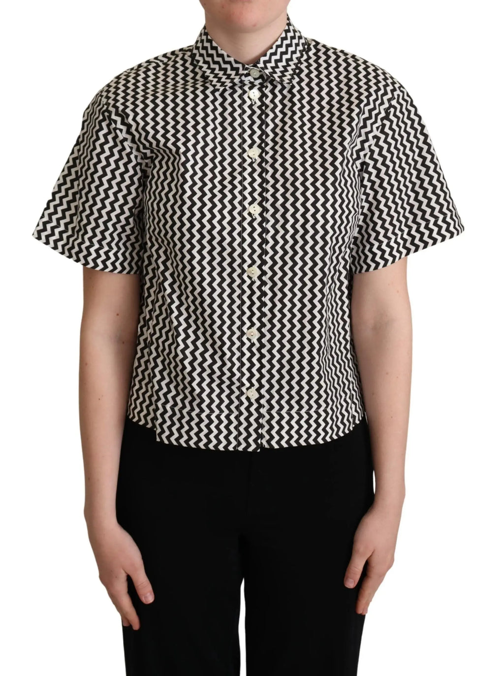 Black and white zigzag patterned cotton short-sleeve top with pointed collar and button front.