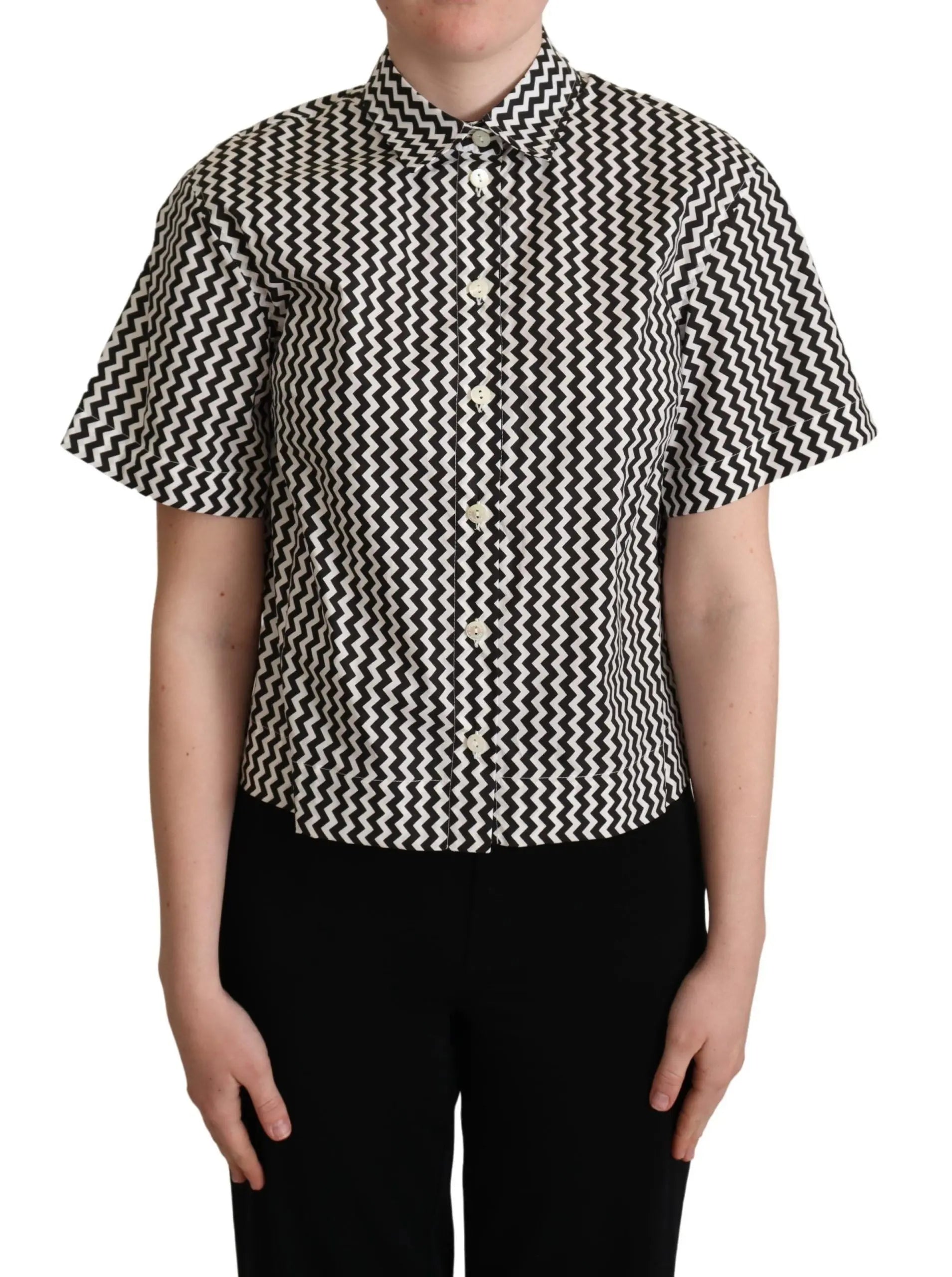 Black and white zigzag patterned cotton short-sleeve top with pointed collar and button front.