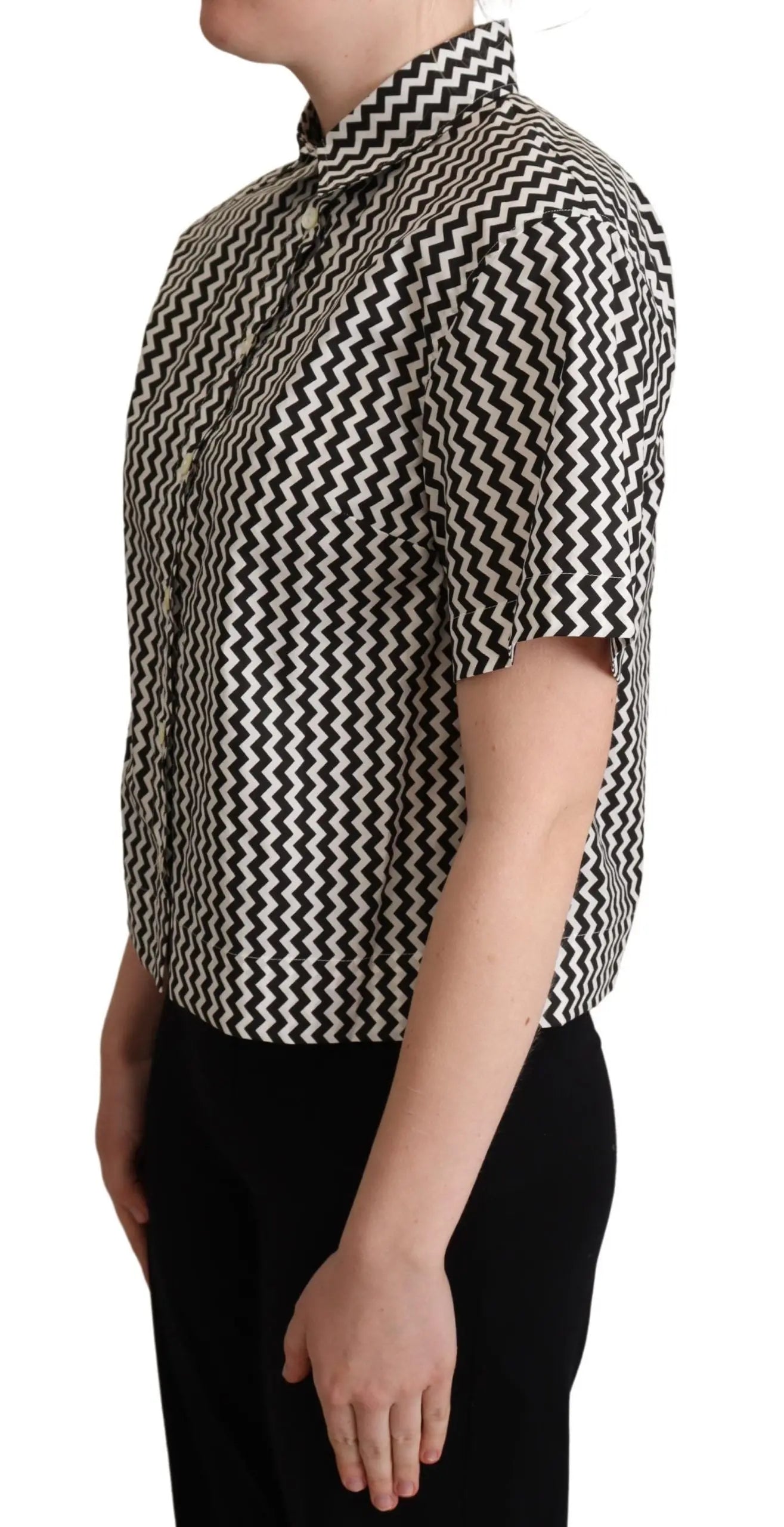 Black and white zigzag patterned cotton short-sleeve top with pointed collar and button front.