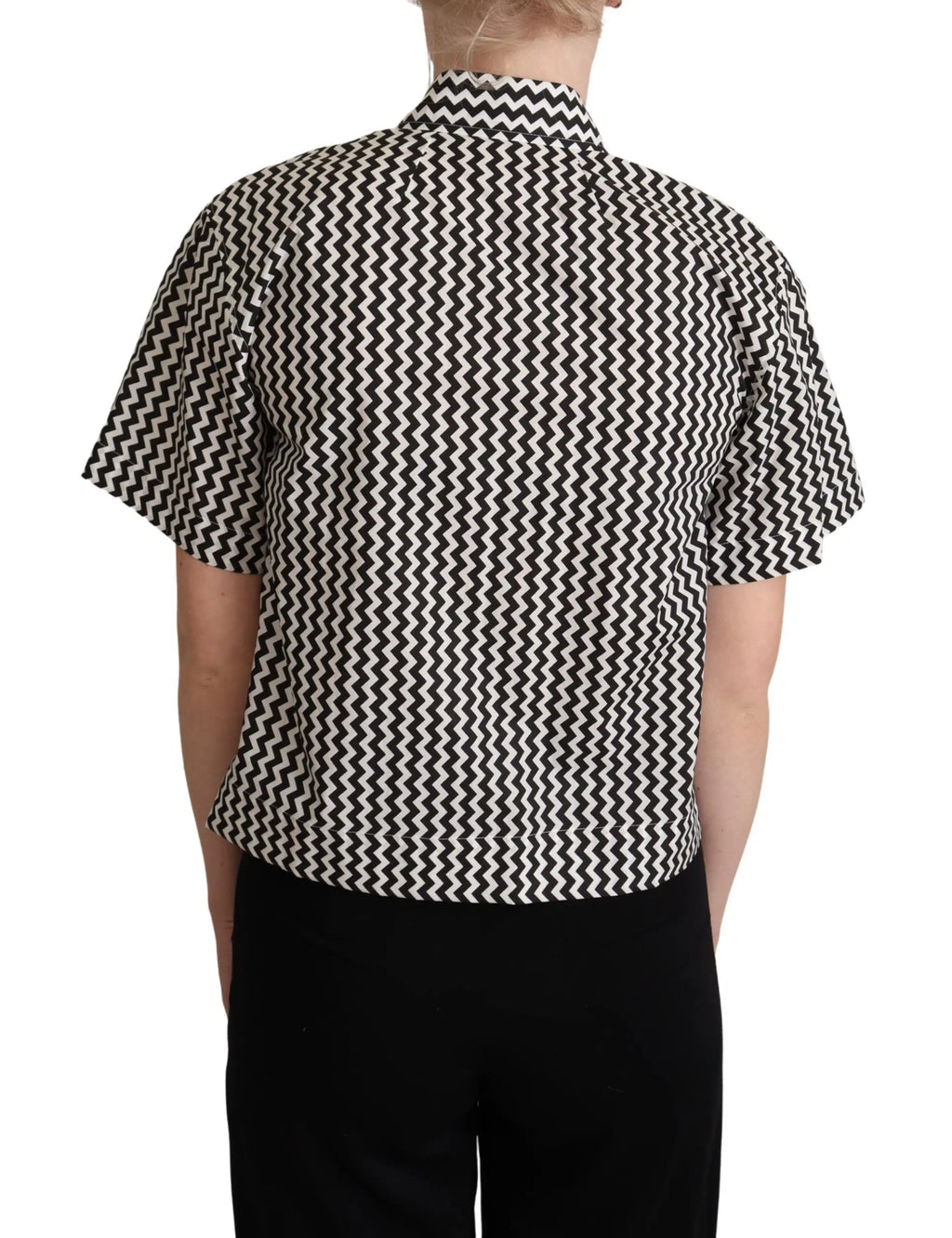 Black and white zigzag patterned cotton short-sleeve top with pointed collar and button front.