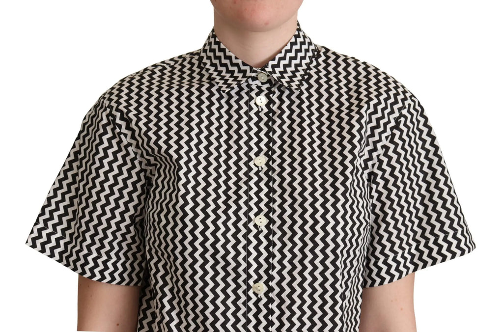 Black and white zigzag patterned cotton short-sleeve top with pointed collar and button front.