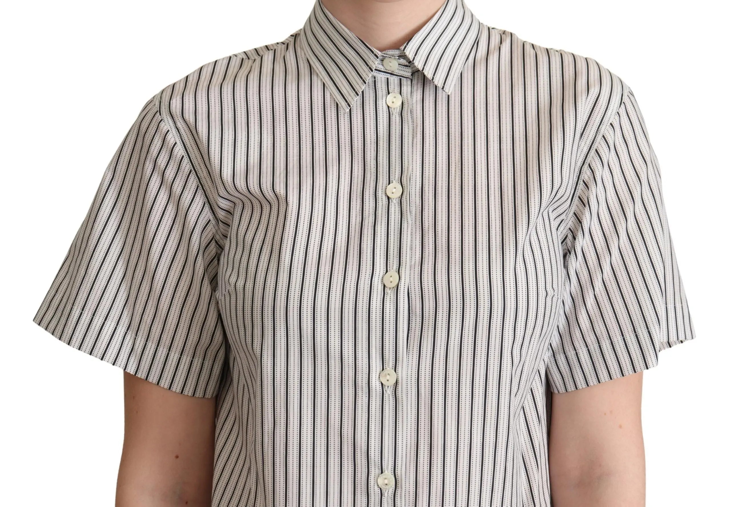 White short-sleeve collared shirt with thin black vertical stripes and button front.
