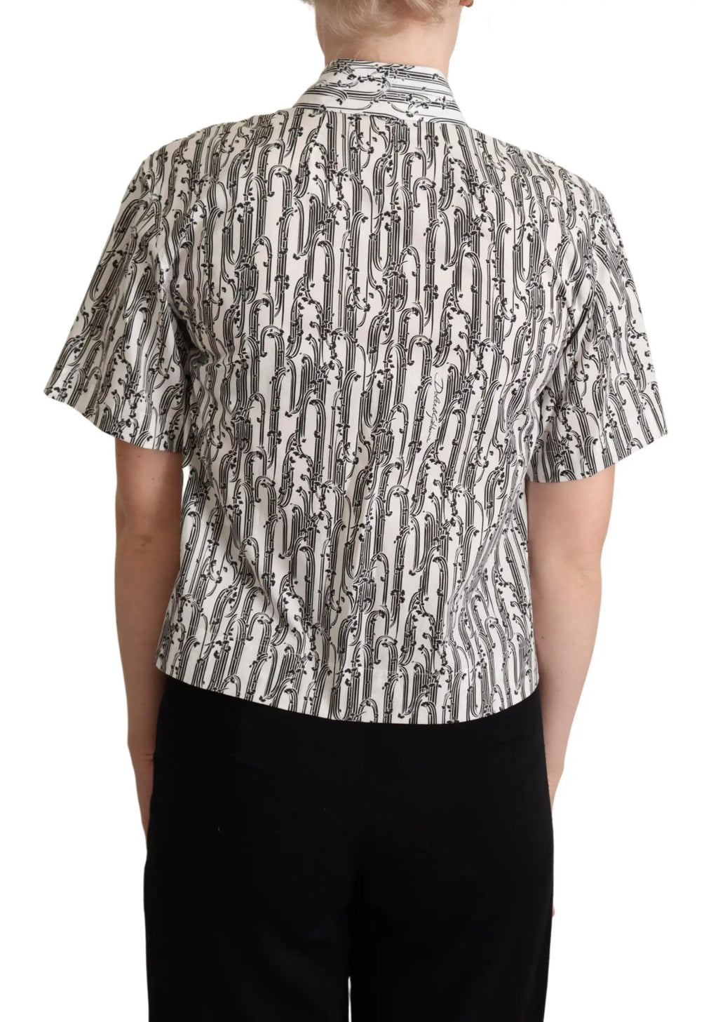 White short-sleeve collared blouse with black abstract floral print, button-down front, fitted cut.