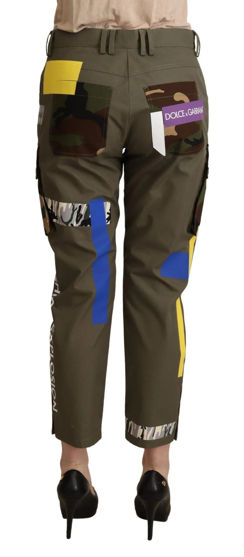 Green cotton cargo pants with multicolor patchwork and pockets, tapered fit.