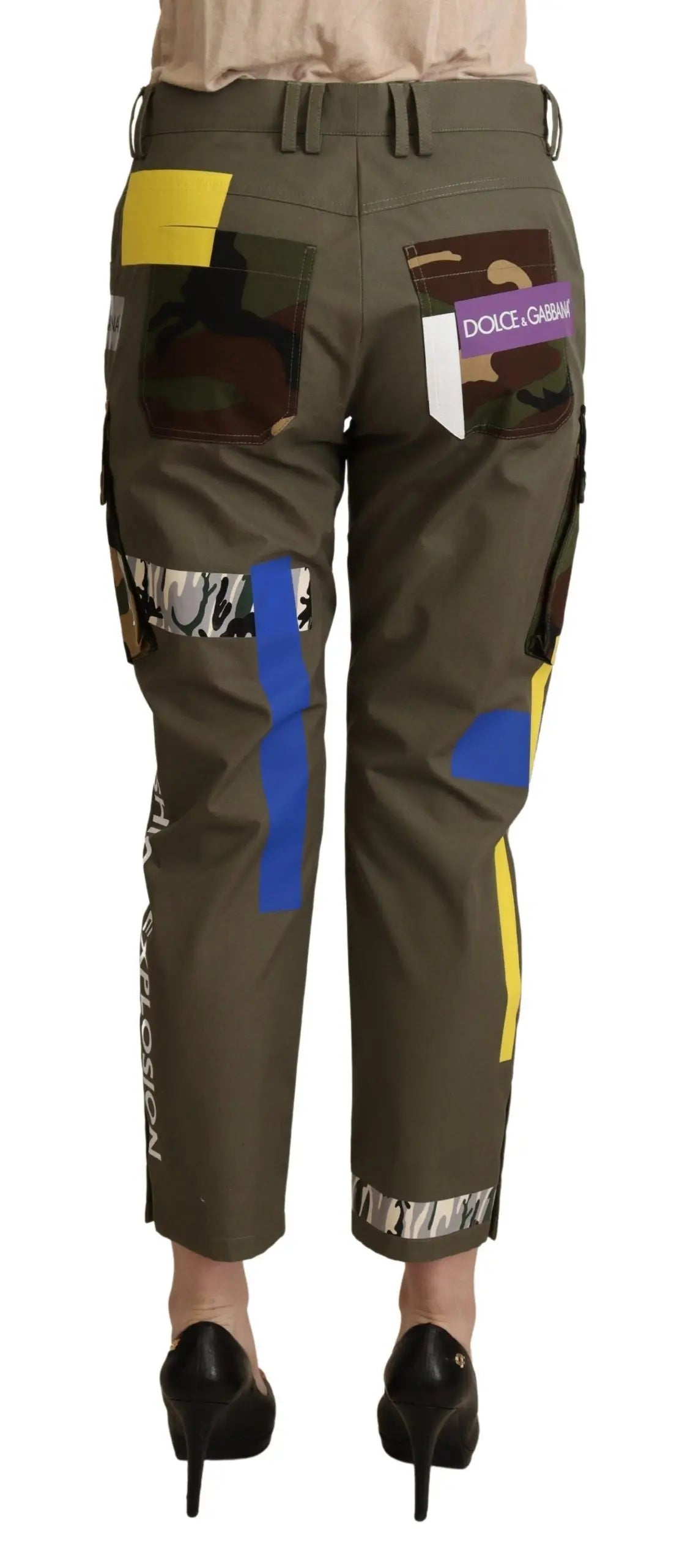 Green cotton cargo pants with multicolor patchwork and pockets, tapered fit.