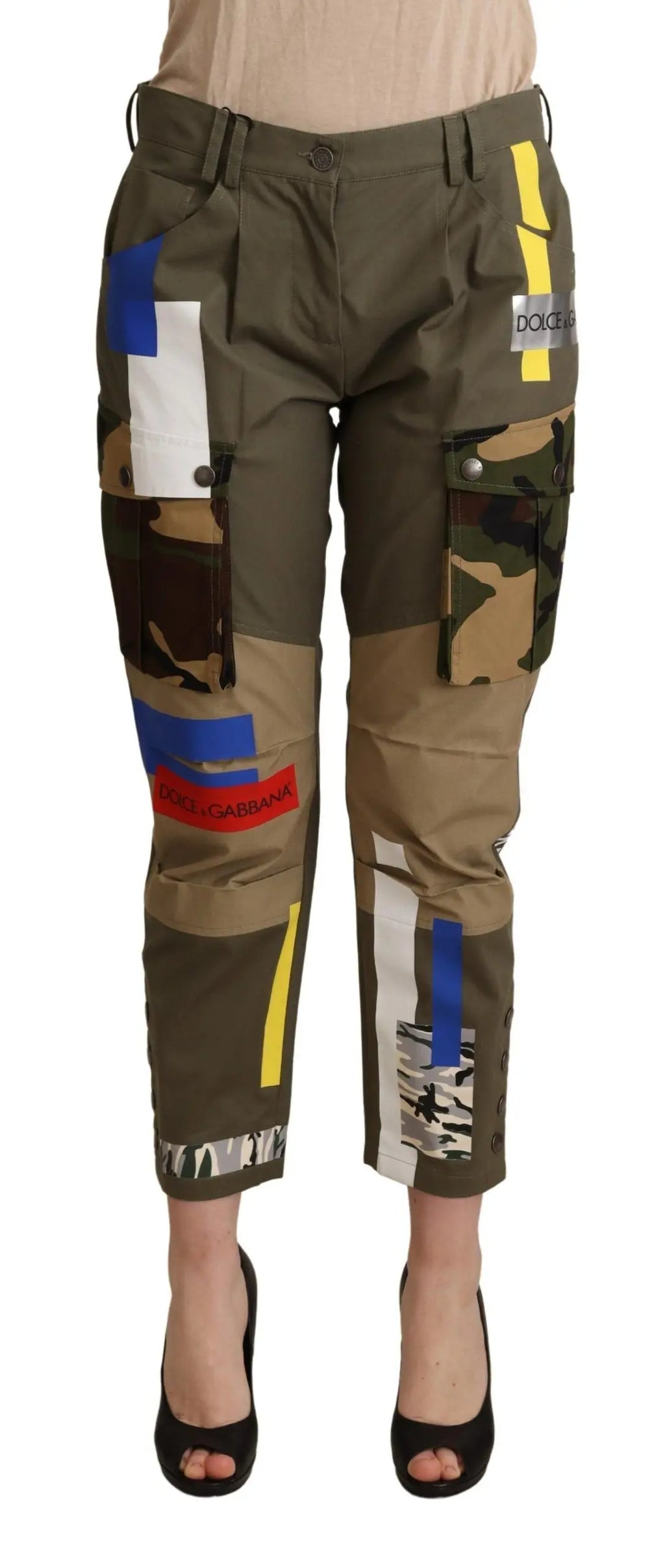 Green cotton cargo pants with multicolor patchwork and pockets, tapered fit.