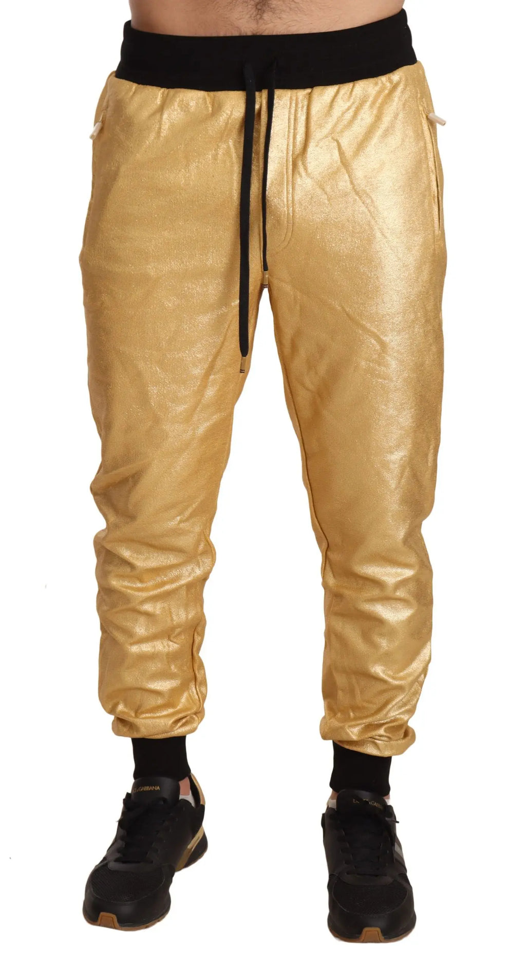 Gold cotton jogger pants with black elastic waistband and cuffs, slim fit design.