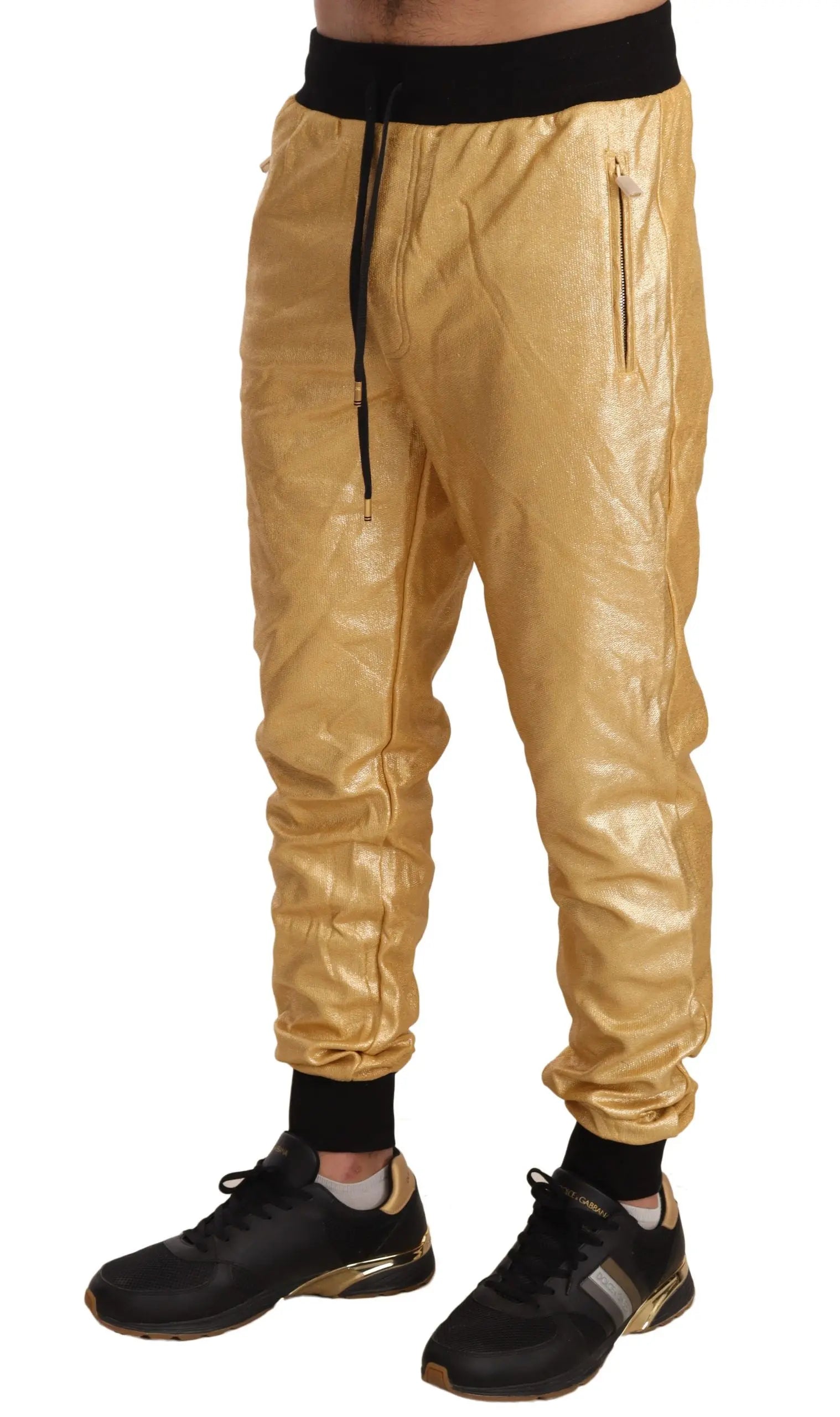 Gold cotton jogger pants with black elastic waistband and cuffs, slim fit design.