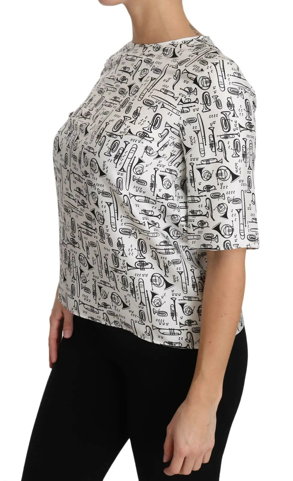 White silk blouse with black musical instrument sketches, short sleeves, crew neck, relaxed fit.