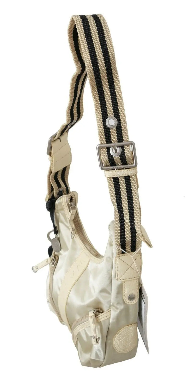White fabric crossbody sling bag with beige trim and adjustable striped shoulder strap.